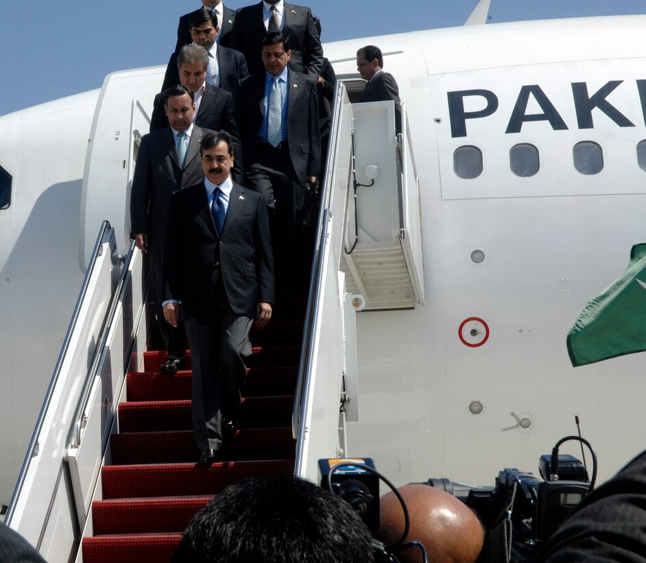 Prime Minister of Pakistan, Yousaf Raza Gillani, descends from an aircraft on the flight line at Joint Base Andrews, Md., April 11, 2010. The national delegate landed at Andrews on his way to the Nuclear Security Summit hosted by President Barack Obama in Washington, D.C., which slated for Monday and Tuesday. The 316th Wing is leading operations to provide safe, effective, and efficient arrival and departure services for the invited guests transiting Andrews. (U.S. Air Force photo by Staff Sergeant Keyonna Fennell).