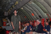 Tech. Sgt. Tara Kirkpatrick, a boom operator with the 916th Air Refueling Wing, Air Force Reserve, has North Carolina employers laughing aboard a KC-135R Stratotanker during a recent ESGR bosslift. (USAF photo by Maj. Shannon Mann, 916ARW/PA)