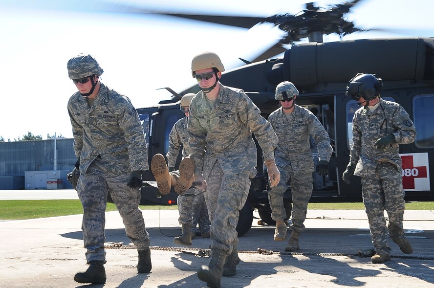 Tactical Air Control Party members from the 2nd and 4th Air Support Operations Squadron practice off-loading a patient from a UH-60 Blackhawk during training on contingency aeromedical evacuation procedures, Grafenwoehr Army Airfield, Germany, April 7, 2010.The 2nd ASOS kicked off a 45 day pre-Afghanistan training plan, sharpening critical combat skills in preparation for upcoming Operation Enduring Freedom deployments. (U.S. Air Force photo by Senior Airman Tony R. Ritter)

