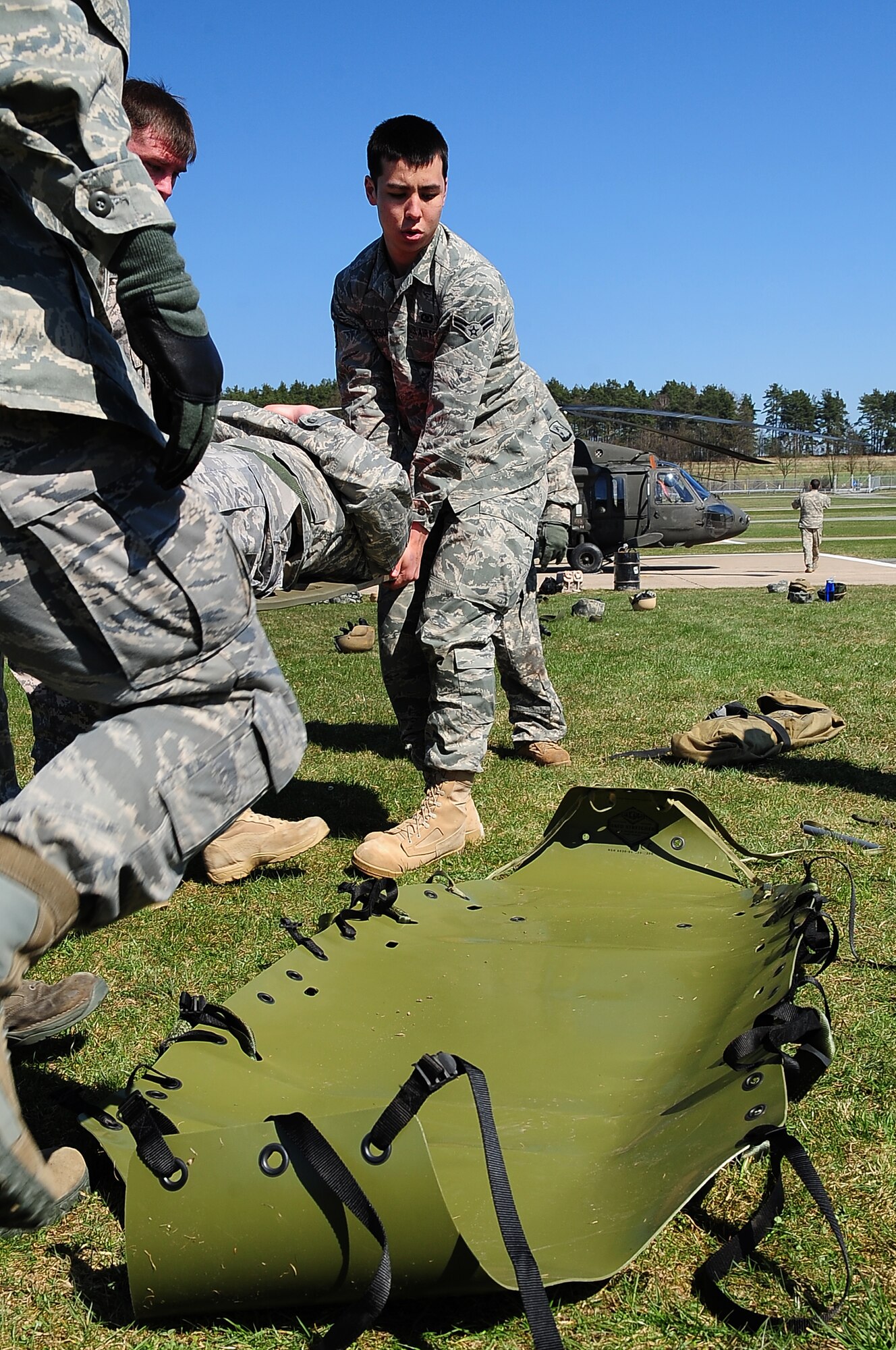 U.S. Air Force Airman 1st Class Timothy Jackson,Tactical Air Control Party member along with other members of the 2nd Air Support Operations Squadron,
loads a patient onto a sked litter during training on contingency aeromedical evacuation procedures, Grafenwoehr Army Airfield, Germany, April 7, 2010.The 2nd ASOS kicked off a 45 day pre-Afghanistan training plan, sharpening critical combat skills in preparation for upcoming Operation Enduring Freedom deployments. (U.S. Air Force photo by Senior Airman Tony R. Ritter)



