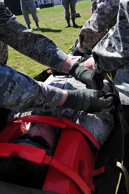 U.S. Air Force Airman 1st Class Robert Carmichael,Tactical Air Control Party member, 2nd Air Support Operations Squadron, simulates being a patient during training on contingency aeromedical evacuation procedures, along with other members of the 2nd ASOS, Grafenwoehr Army Airfield, Germany, April 7, 2010.The 2nd ASOS kicked off a 45 day pre-Afghanistan training plan, sharpening critical combat skills in preparation for upcoming Operation Enduring Freedom deployments. (U.S. Air Force 
photo by Senior Airman Tony R. Ritter)



