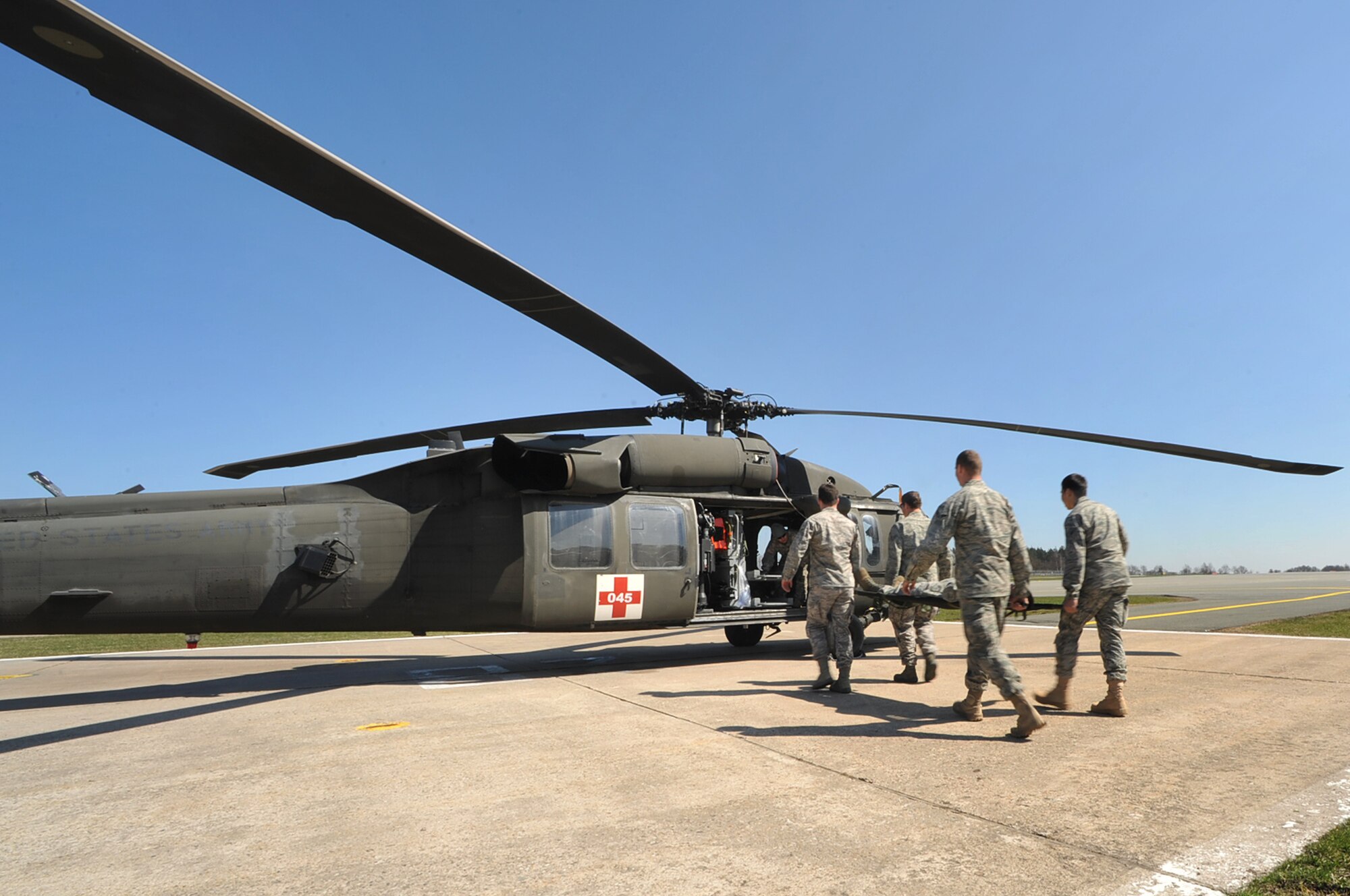 Tactical Air Control Party members from the 2nd and 4th Air Support Operations Squadron practice loading a patient onto a UH-60 Blackhawk during training on contingency aeromedical evacuation procedures, Grafenwoehr Army Airfield, Germany, April 7, 2010.The 2nd ASOS kicked off a 45 day pre-Afghanistan training plan, sharpening critical combat skills in preparation for upcoming Operation Enduring Freedom deployments. (U.S. Air Force photo by Senior Airman Tony R. Ritter)

