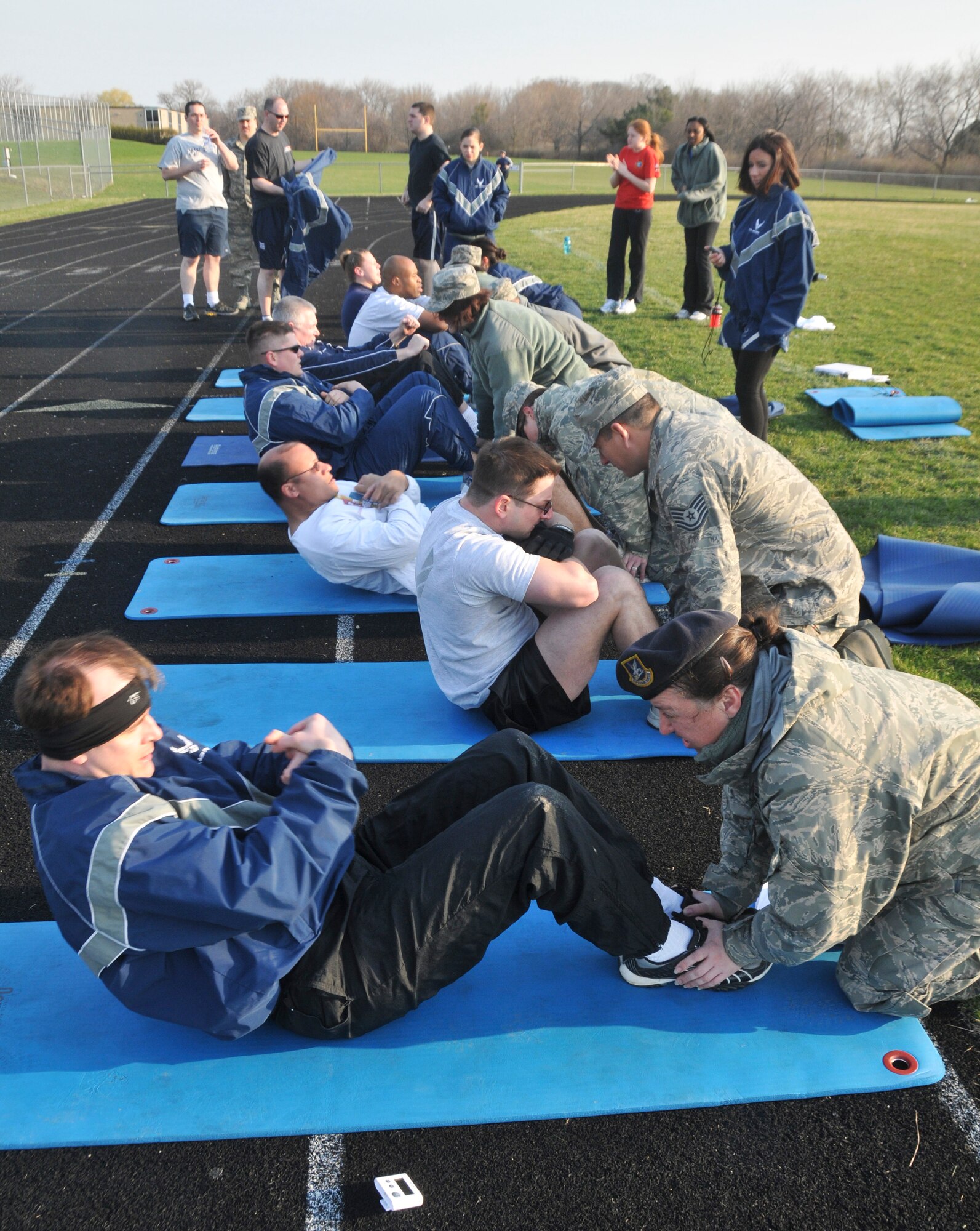 MILWAUKEE -- Airmen from the 128th Air Refueling Wing perform their annual physical training test at Cudahy High School on the morning of Saturday, April 10, 2010.  

The PT test was one of the wing's last testing sessions before the new Air Force fitness standards come into effect in July.