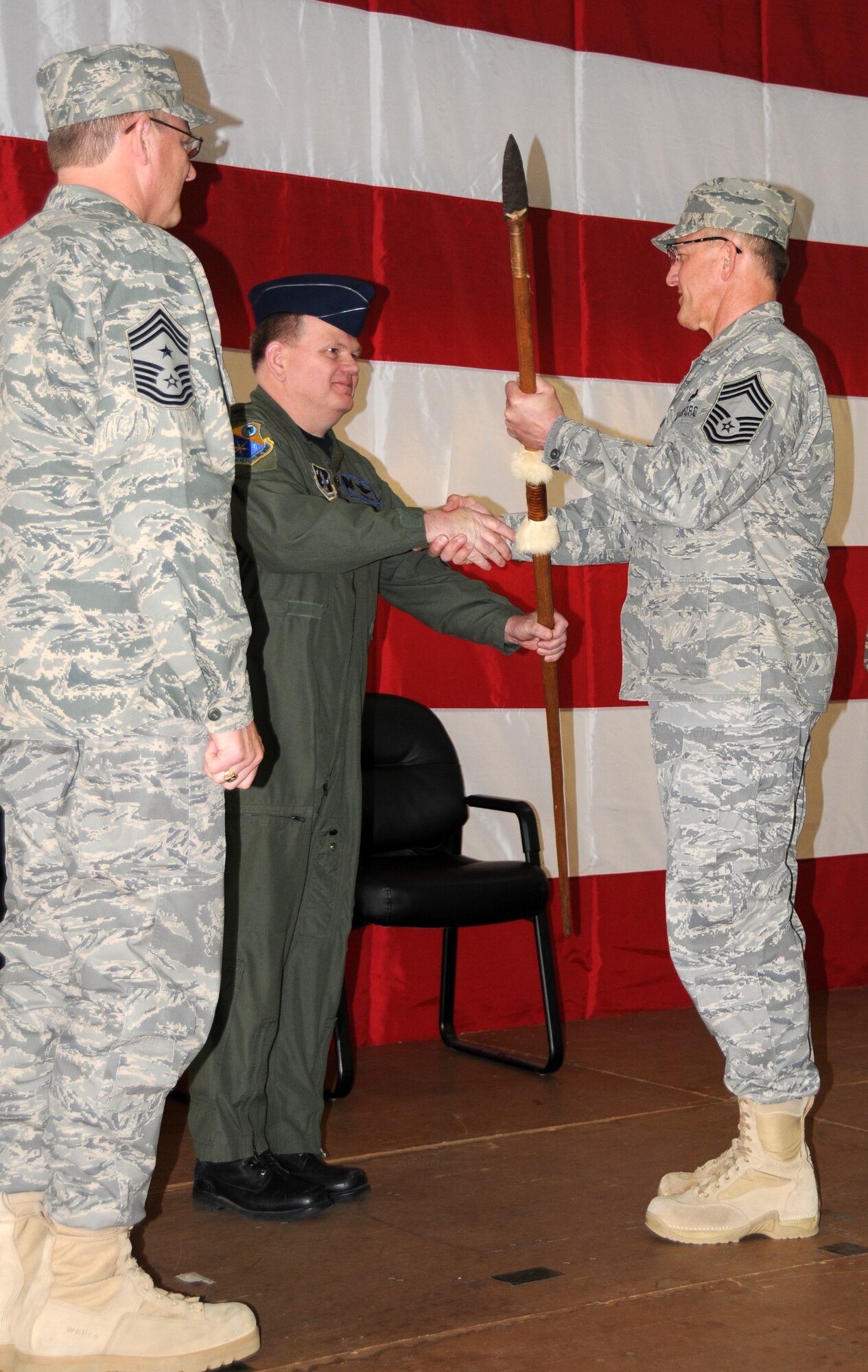 Col. Brian Miller, Wing Commander of the 185th Air Refueling Wing passes the Command Chief's Spear to the new Command Chief, Chief Dave Miller, on Saturday. April 10, 2010. 
Air Force Photo by: Tech Sgt. Oscar Sanchez
