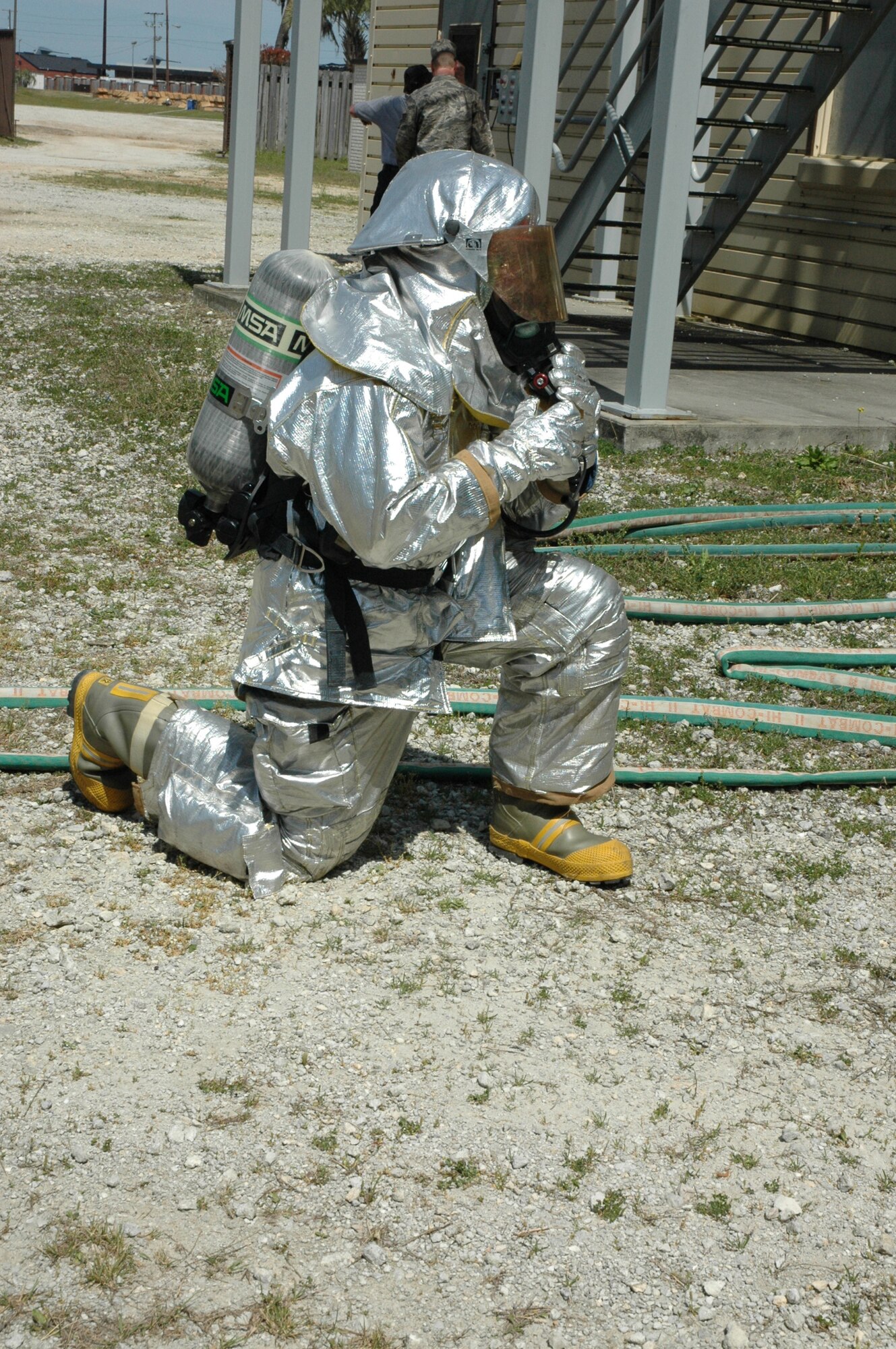 Seventeen firefighters assigned to 315th Civil Engineering Flight donned their aircraft rescue suits for mandatory daytime live fire training Saturday, April 10 at Charleston Air Force Base, S.C. Sweeping through the ‘burn building’ in teams of four, the firefighters were required to extinguish a simulated kitchen fire burning up to 700 degrees before backing out of the structure. Each run-through also allowed the firefighters additional training on the fire rescue truck by repacking the hose and returning the truck to a ‘serviceable’ condition. (U.S. Air Force photo by Senior Airman Dani Shea / Released)