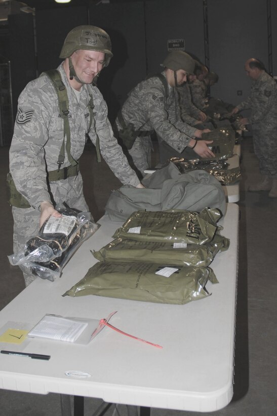 Technical Sgt. Jeff Jorgenson lays the contents of his mobility bag out to verify that all required items are accounted for during an Operational Readiness Exercise held in the Supply building of the 132d Fighter Wing (132FW), Des Moines, Iowa on April 10, 2010.  The 132FW is preparing for an Operational Readiness Inspection, which will take place in October.  (US Air Force photo/Staff Sgt. Linda E. Kephart)(Released)