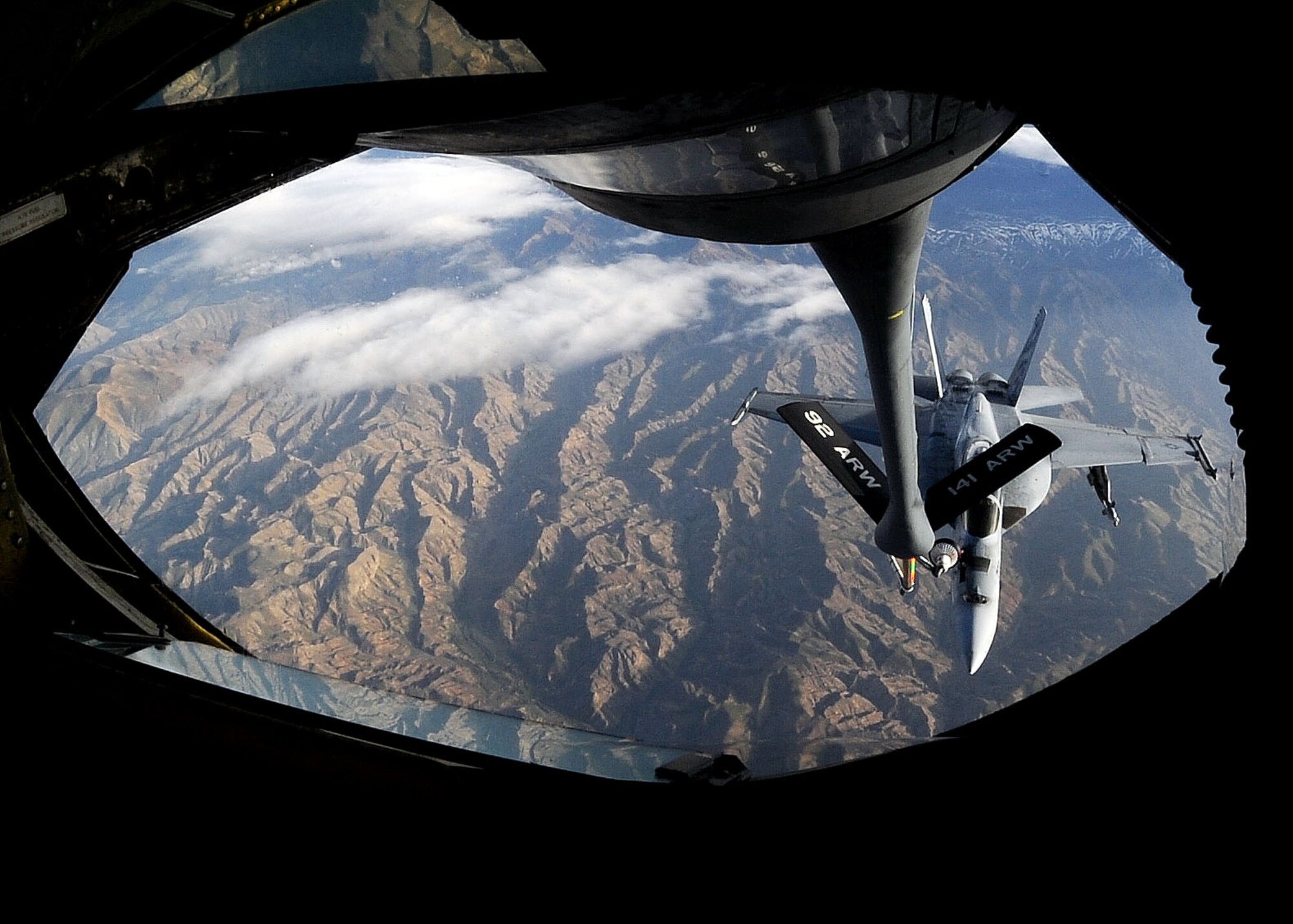 A U.S. Navy F/A-18 Hornet Strikefighter receives fuel from a 22nd Expeditionary Air Refueling Squadron KC-135 Stratotanker over Afghanistan April 10, 2010. April 10 went down in 22nd EARS history when an air crew logged the 16,000th sortie. (U.S. Air Force photo/Senior Airman Nichelle Anderson/released)