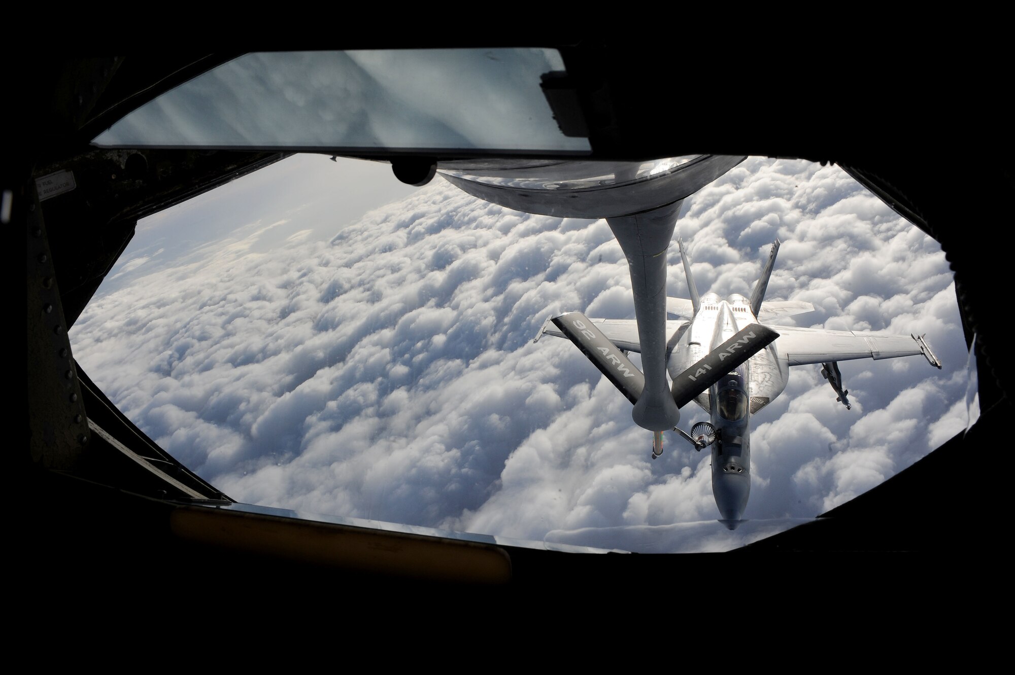 A U.S. Navy F/A-18 Hornet Strikefighter receives fuel from a 22nd Expeditionary Air Refueling Squadron KC-135 Stratotanker over Afghanistan April 10, 2010. The day of April 10 made 22nd EARS history when an air crew logged the 16,000th sortie. (U.S. Air Force photo/Senior Airman Nichelle Anderson/released)