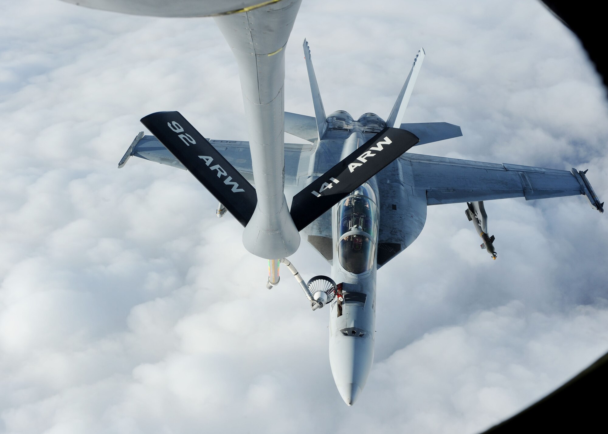 A U.S. Navy F/A-18 Hornet Strikefighter receives fuel from a 22nd Expeditionary Air Refueling Squadron KC-135 Stratotanker over Afghanistan April 10, 2010. The day of April 10 made 22nd EARS history when an air crew logged the 16,000th sortie. (U.S. Air Force photo/Senior Airman Nichelle Anderson/released)