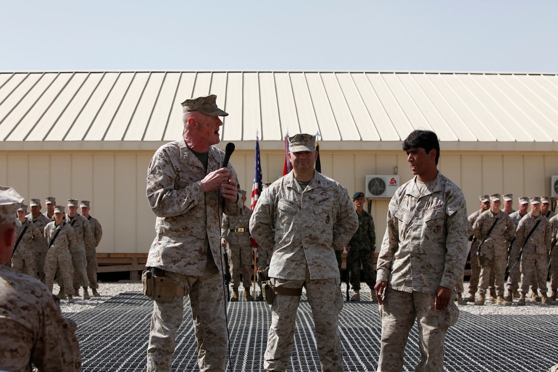 Brig. Gen. Larry Nicholson, Marine Expeditionary Brigade-Afghanistan commanding general, speaks after the transfer of authority ceremony at Camp Leatherneck, Helmand province, Afghanistan, Monday.  During the speech Brig. Gen. Nicholson expressed his gratitude for the hard work and helping hand that Gulab Mangal, the Helmand province governor, gave to the Marines during their stay in Afghanistan.