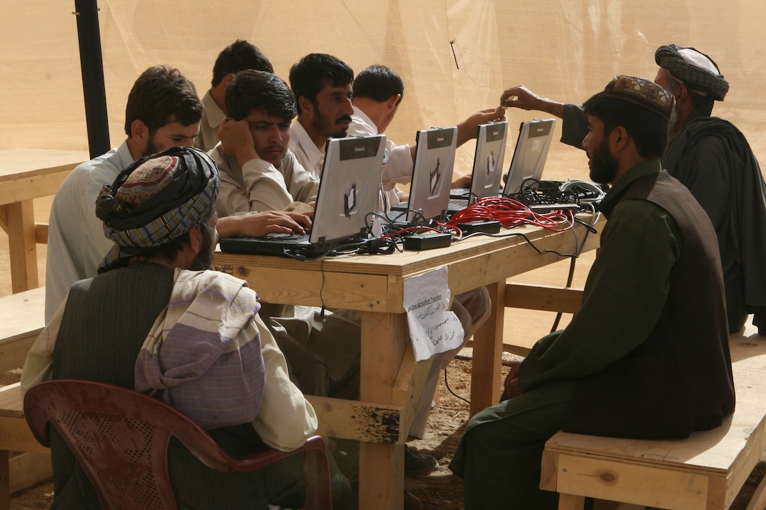 Participants in the Marjah Accelerated Agricultural Transition program register their crops and where they live, at the government center in Marjah, Afghanistan, April 13. Marines and Afghan National Army soldiers with 1st Battalion, 6th Marine Regiment are taking part in the Marjah Accelerated Agricultural Transition program, which is a project aimed at facilitating the transition from illicit to licit crops.