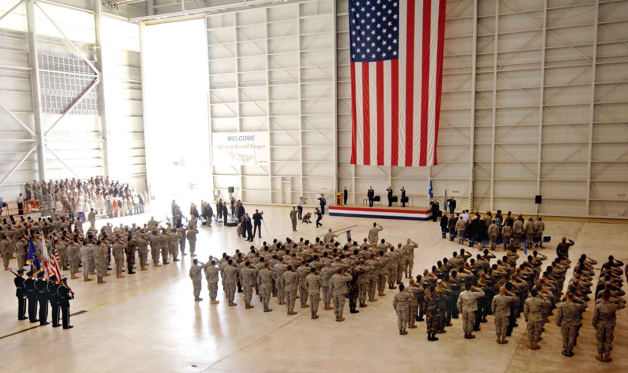 The members of the March Blue Eagles Total Force Honor Guard prepare to post the colors at the opening of the 452nd Air Mobility Wing Change of Command Ceremony in the C-17 hangar at March ARB, March 27 (U.S. Air Force photo by Senior Airman Jimmy L. Dang)