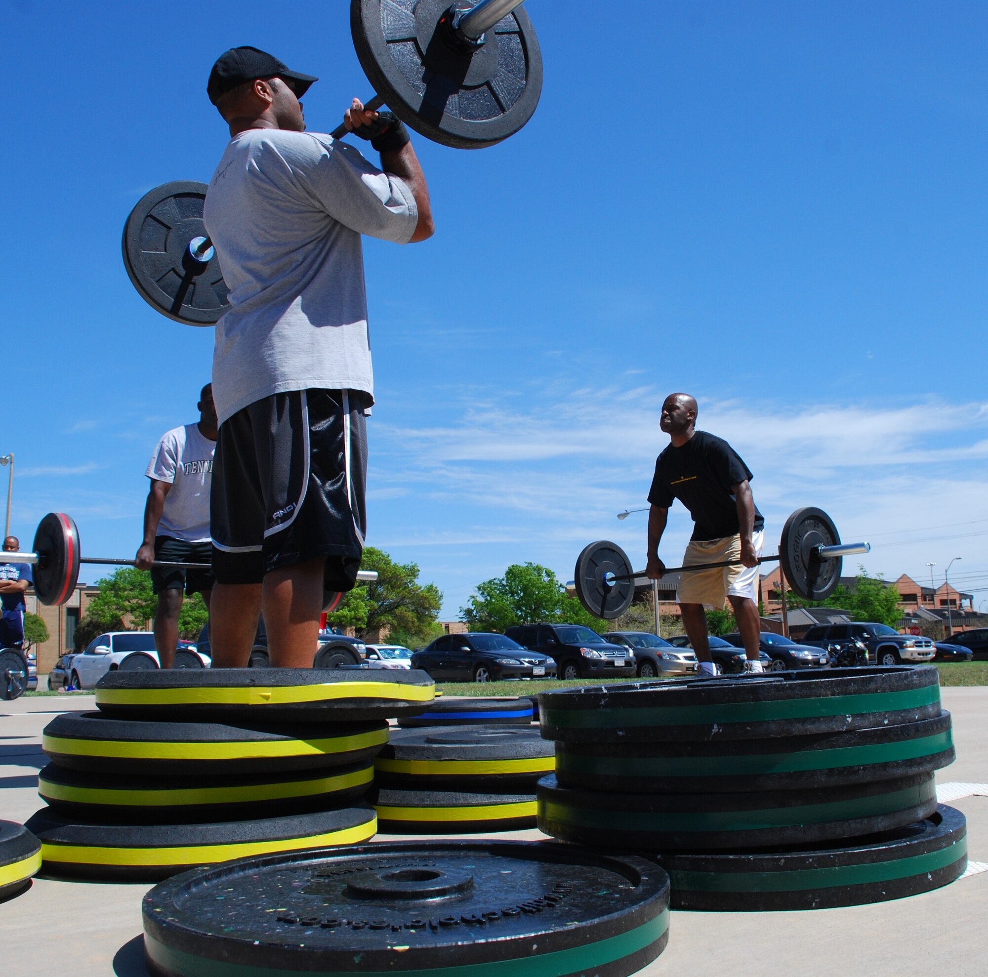 Members of Team Sheppard practice Olympic-style weight lifting to help build power and explosion during their workout in the Combat Fit program offered by the Health and Wellness Center April 9, 2010.  Combat Fit members have performed weight lifting, cardio workouts, plyometrics and other types of exercises to improve combat readiness.  (U.S. Air Force photo/Tech Sgt. Vernon Cunningham)
