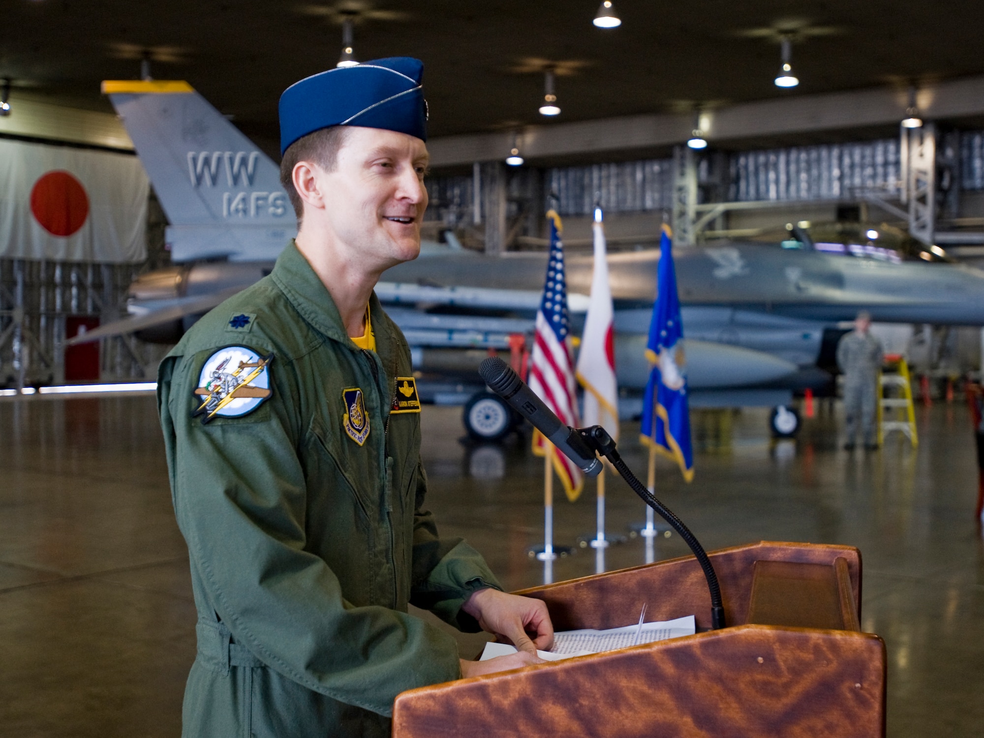 MISAWA AIR BASE, Japan -- Lt. Col. Aaron Steffens, 14th Fighter Squadron commander, delivers an acceptance speech to friends, family and the 14th FS after assuming command April 9 at Hangar 911. Colonel Steffens assumed command of the squadron from Lt. Col. Shane Riza. (U.S. Air Force photo/Senior Airman Jamal D. Sutter)