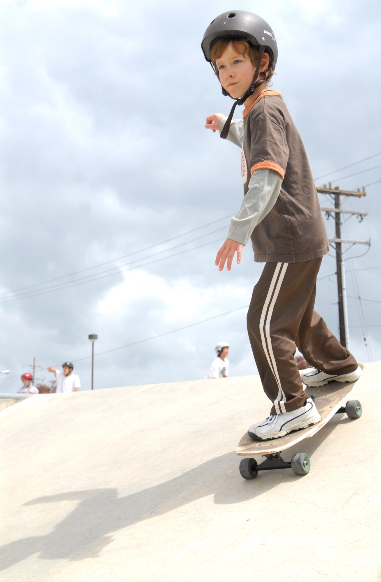 VANDENBERG AIR FORCE BASE, Calif. -- Making his way down the ramp, a military dependent practices his skateboarding skills during Skate-a-Palooza here Saturday, April 10, 2010. Skate-a-Palooza was a free event in which Vandenberg skaters could ply their sport alongside fellow athletes. (U.S. Air Force photo/Senior Airman Ashley Reed)