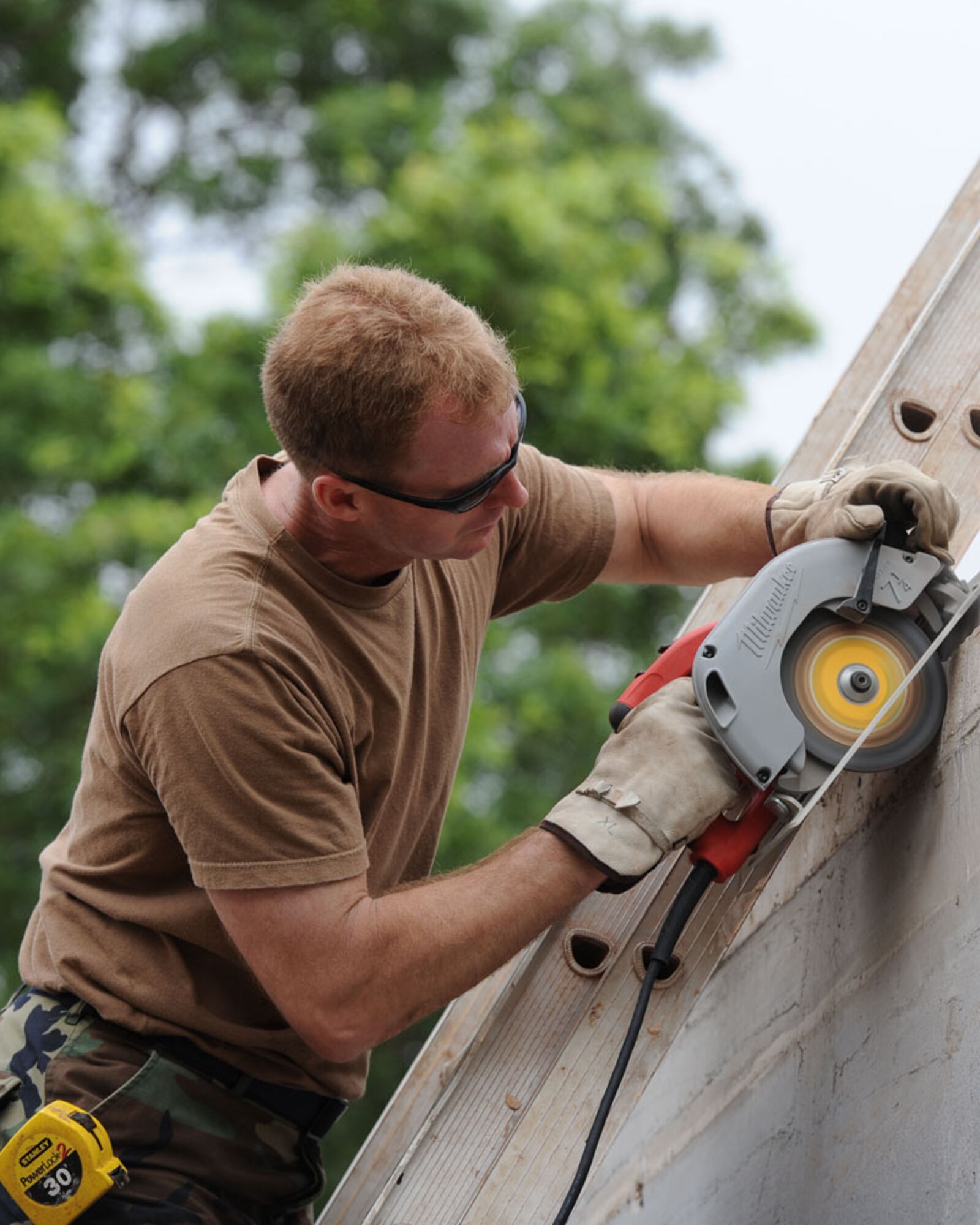 Master Sgt. Jeff Talaga works on a construction site on Akota air base in Accra, Ghana. Sgt. Talaga served as the noncommissioned officer in charge of the work project, to build a technical training building for use by the Ghana Air Force. Talaga is a member of the 127th Civil Engineering Squadron, Michigan Air National Guard, from Selfridge Air National Guard Base. (U.S. Air Force photo by TSgt. Dan Heaton)