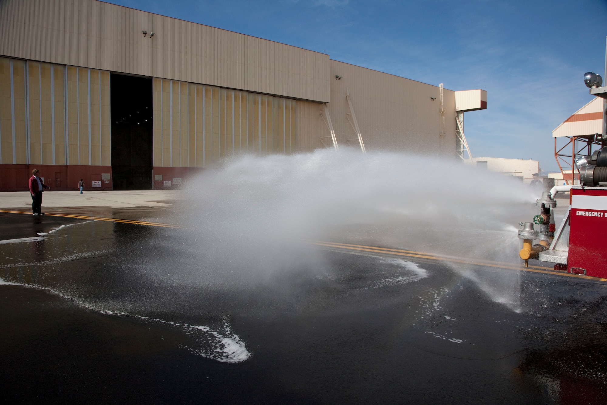 A custom made spray bar demonstrates its spraying technique.  Engineers from different squadrons around Edwards combined their talents to create the spray bar used for wet runway testing.  A custom made spray bar is needed due to the high water pressure from the tanker truck and the unique spray patterns needed for wet runway testing.  (Air Force photo by Chad Bellay)  