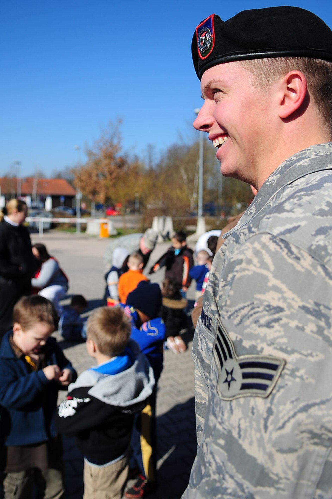 Senior Airman Truman Smith enjoys a laugh as he volunteers in the child development center's "Boot Camp Week" April 7, 2010, at the child development center at Rose Barracks, Vilseck Military Community, Germany. "Boot Camp Week" gave servicemembers' children an opportunity to experience some military norms such as physical training, first aid, land navigation and tactical vehicle familiarization in support of the Department of Defense's Month of the Military Child. Airman Smith is a 2nd Air Support Operations Squadron tactical air control party member. (U.S. Air Force photo/Senior Airman Tony R. Ritter)