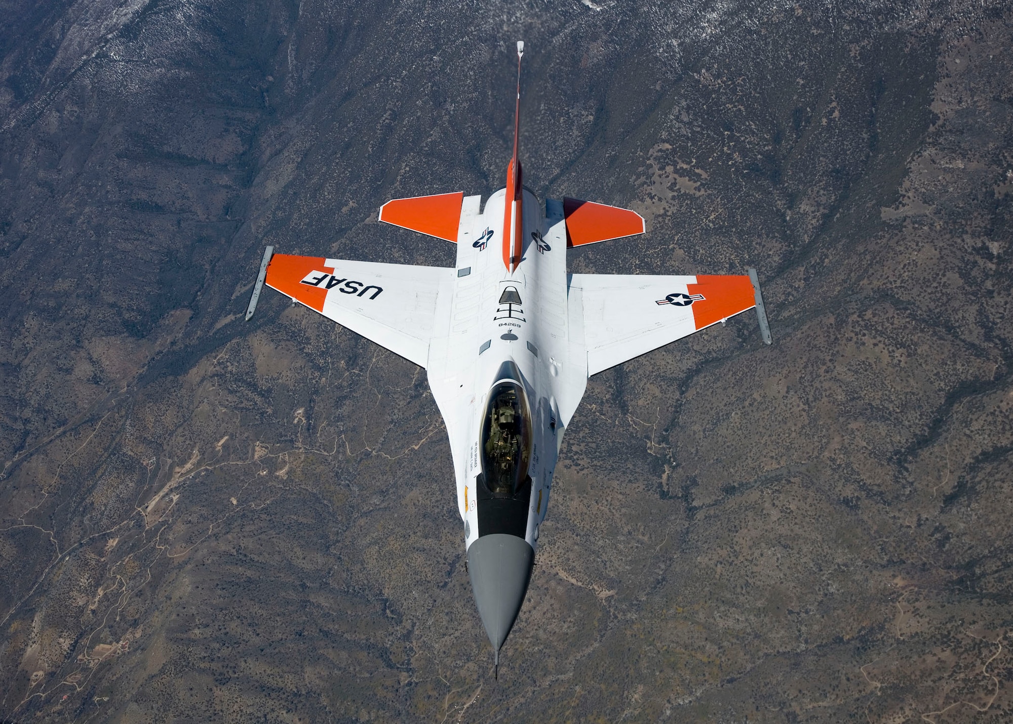 An F-16 Fighting Falcon fitted with radio frequency identification tags pulls in behind  an NKC-135 Stratotanker during an aerial flight test April 7, 2010. The mission was to test the Automatic Receiver Aircraft Identification system installed on the NKC-135 test tanker.  (U.S. Air Force photo/Chad Bellay)