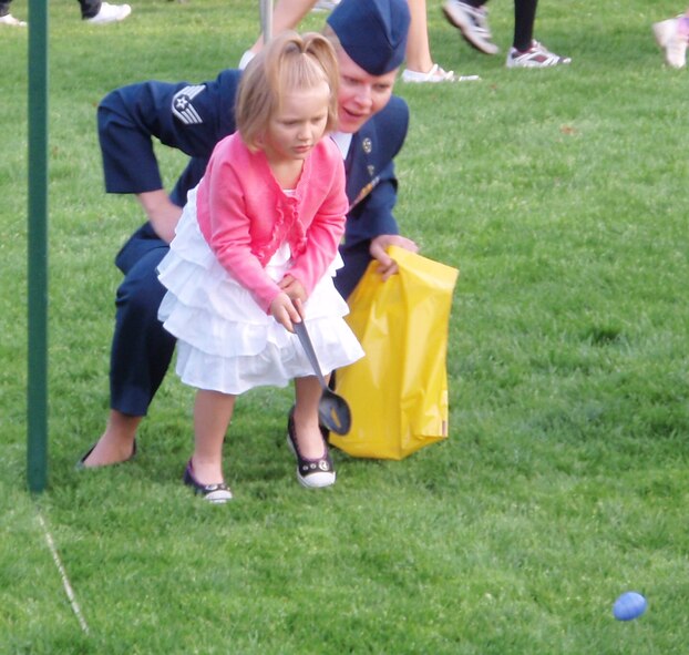 Ava, the 4-year-old daughter of Staff Sgt. Stacia Zachary, 96th Air Base Wing, moves her egg forward during the Easter Egg Roll event at the White House April 5.  Team Eglin warriors and their families were invited to particpate in the event.  (Courtesy photo.)
