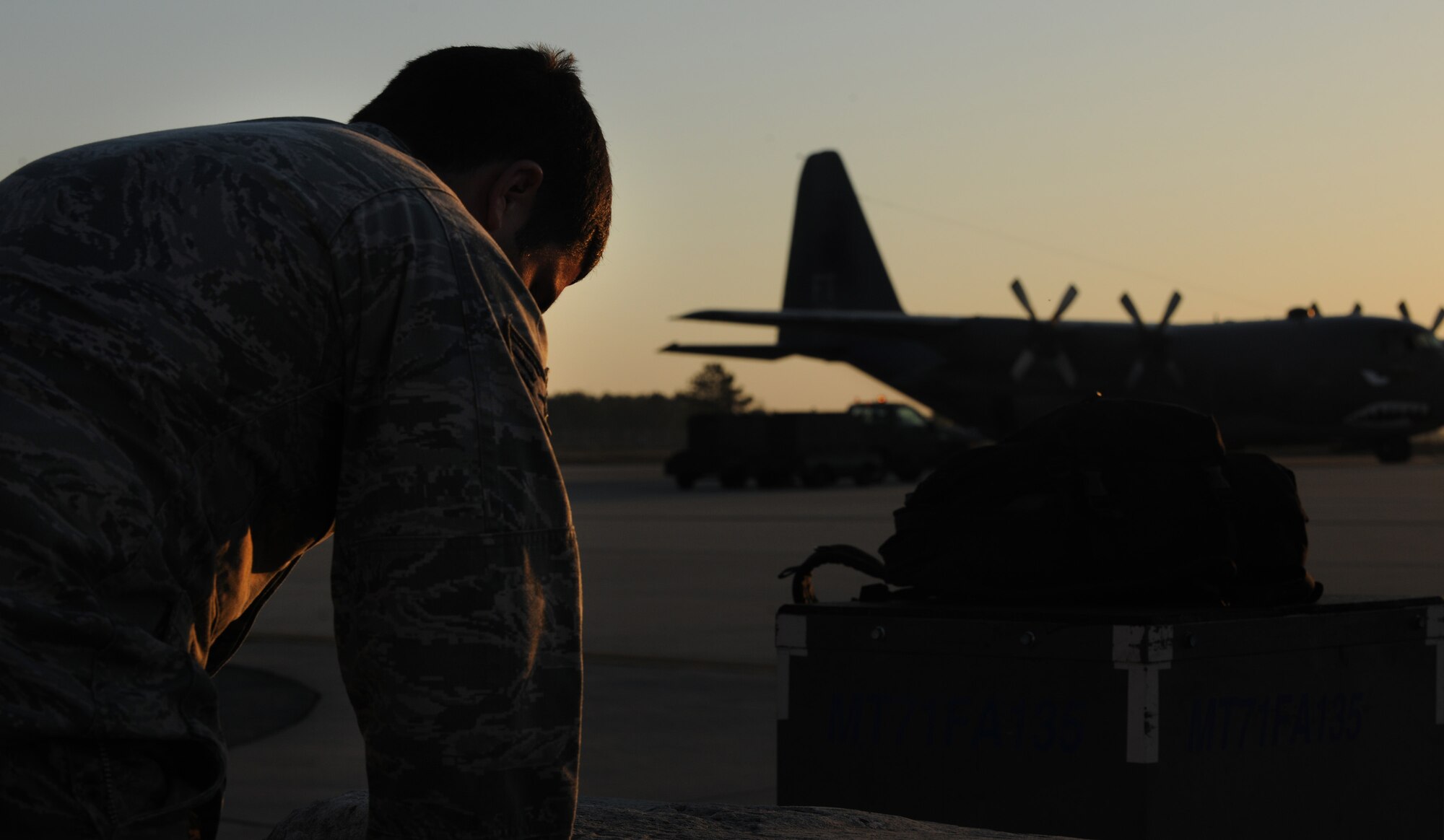 MOODY AIR FORCE BASE, Ga. -- Senior Airman Freddie Kight, 38th Rescue Squadron survival, evasion, resistance and escape specialist, does a final check of his bag before boarding a C-130E Hercules aircraft here April 12. The 38th Rescue Squadron will join other Air Force Guardian Angel and special tactic teams during exercise Angel Thunder held at Davis-Monthan Air Force Base, Ariz.. (U.S. Air Force photo by Airman 1st Class Benjamin Wiseman/RELEASED)