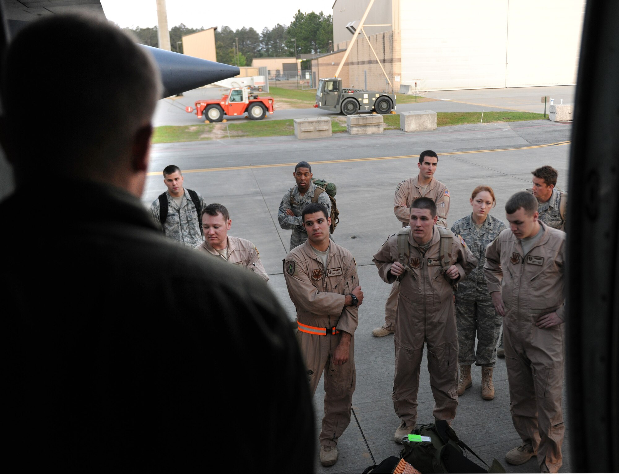 MOODY AIR FORCE BASE, Ga. -- Senior Airman Josh Oliver, 79th Rescue Squadron C-130 loadmaster, gives a preflight brief to personnel before they board the C-130E Hercules aircraft here April 12. Airman Oliver informed the group of all exit procedures and evacuation points in case of an emergency. (U.S. Air Force photo by Airman 1st Class Benjamin Wiseman/RELEASED)