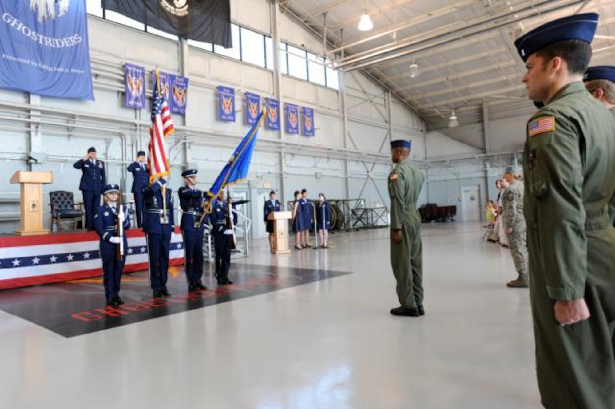 Soon-to-be members of the 34th Special Operations Squadron salute the American flag during reactivation and redesignation ceremony held at the Commando Hangar April 9, 2010. In the ceremony, the 1st Special Operations Group reactivated and redesignated the 34th Troop Carrier Squadron as the 34th Special Operations Squadron and Lt. Col. Justin Hoffman was named commander, continuing a legacy that began more than 65 years ago. (U.S. Air Force photo by Senior Airman Matthew Loken)