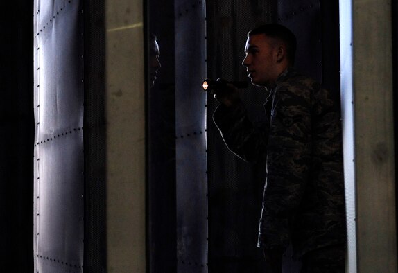 LANGLEY AIR FORCE BASE, Va. -- Airman 1st Class Mathew Santianna inspects ventilation baffles during a foreign object debris walk in the hush house, April 9. These inspections are critical in order to remove any objects that could damage the blades inside the engines. (U.S. Air Force photo/Airman 1st Class Gul Crockett)