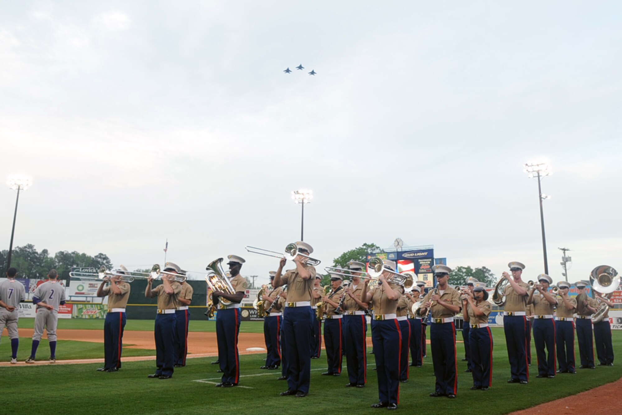 KINSTON, N.C. -- The 2nd Marine Aircraft Wing Band performs the national anthem during the Kinston Indians season opener at Grainger Stadium, April 8, 2010. During the national anthem, Airmen from the 336th Fighter Squadron at Seymour Johnson Air Force Base performed an F-15E Strike Eagle flyover. (U.S. Air Force photo/Senior Airman Ciara Wymbs)