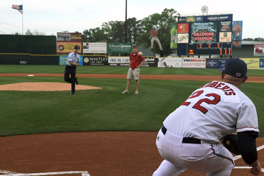 KINSTON, N.C. -- Staff Sgt. Chris Edwards throws the ceremonial first pitch during the Kinston Indians season opener to David Roberts, a K-Tribe pitcher at Grainger Stadium, April 8, 2010. Sergeant Edwards, a crew chief from the 336th Aircraft Maintenance Squadron, was named the 336th AMXS NCO of the year. Sergeant Edwards hails from Estherville, Iowa, and Mr. Roberts is from Renton, Wash. (U.S. Air Force photo/Senior Airman Ciara Wymbs)  