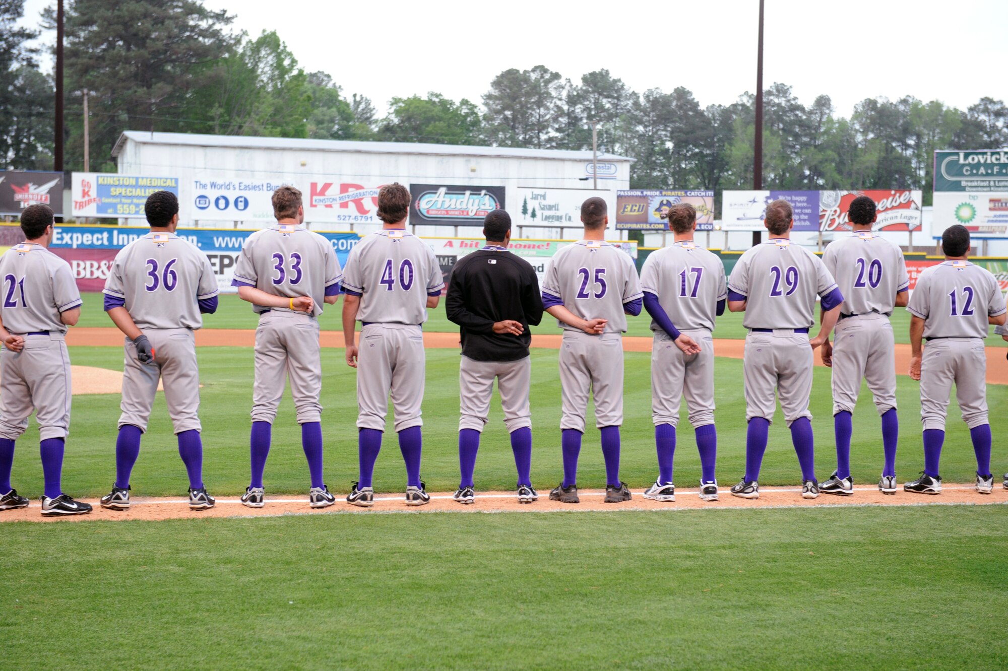 KINSTON, N.C. -- Members of the Winston-Salem Dash pay respects during the playing of the national anthem at Grainger Stadium, April 8, 2010. The national anthem was played by the 2nd Marine Aircraft Wing Band from Marine Corps Air Station, New River. (U.S. Air Force photo/Senior Airman Whitney Lambert) 