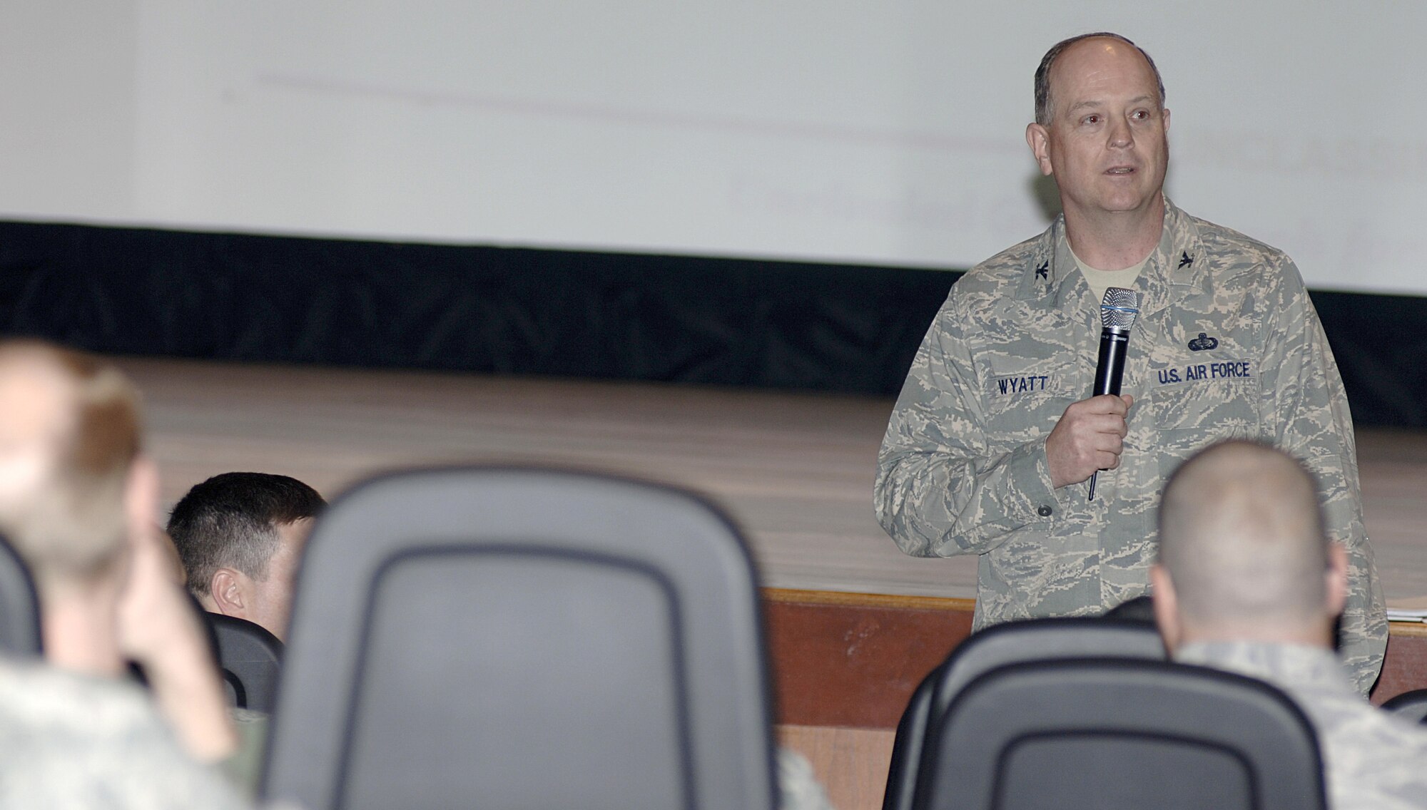 U.S. Air Force Col. Lee Wyatt briefs members of Joint Base Charleston on the impact officers may face regarding the Force Management Program at the base theater here during his recent visit April 8, 2010. The officer voluntary separation programs include voluntary separation pay at two times the severance pay; palace chase reduction in commitment from a 3:1 ratio to a 1:1 ratio; transfer to the Army and active-duty service commitment waivers. Colonel Wyatt is the Air Mobility Command director of manpower. (U.S. Air Force photo/Staff Sgt. Marie Brown)