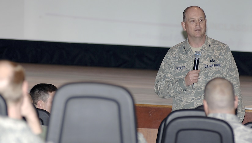 U.S. Air Force Col. Lee Wyatt briefs members of Joint Base Charleston on the impact officers may face regarding the Force Management Program at the base theater here during his recent visit April 8, 2010. The officer voluntary separation programs include voluntary separation pay at two times the severance pay; palace chase reduction in commitment from a 3:1 ratio to a 1:1 ratio; transfer to the Army and active-duty service commitment waivers. Colonel Wyatt is the Air Mobility Command director of manpower. (U.S. Air Force photo/Staff Sgt. Marie Brown)