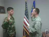 Staff Sgt. Christian R. Vallejo (left), a KC-135 crew chief with the 916th Maintenance Squadron is re-enlisted by his commander, Maj. Jason Martin. (USAF photo courtesy of 916ARW/AMXS)
