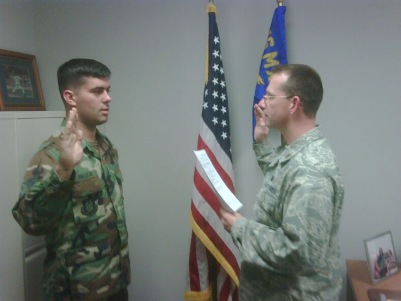 Staff Sgt. Christian R. Vallejo (left), a KC-135 crew chief with the 916th Maintenance Squadron is re-enlisted by his commander, Maj. Jason Martin. (USAF photo courtesy of 916ARW/AMXS)
