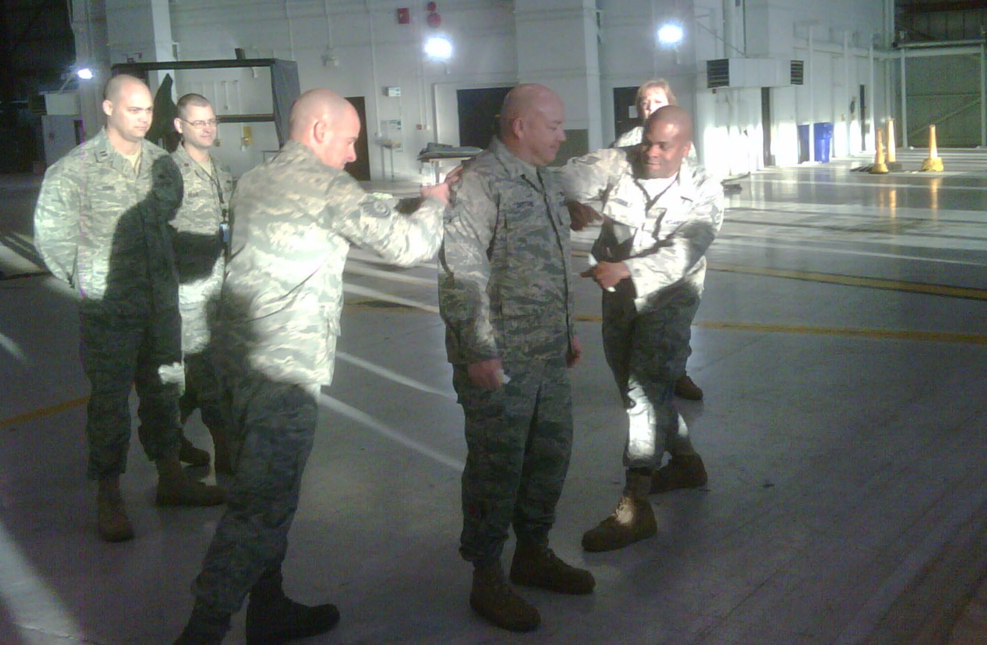 Master Sgt. Dave Sutton (center) gets tagged after have his new rank put on by Tech. Sgt. Rob Fox and Staff Sgt. Charles Gault. Click on the story to see what other 916th Airmen have recently been promoted. (USAF photo courtesy of 916ARW/AMXS)