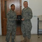 Lt. Col. James Horton (right), commander of the 916th Communication Squadron, bids farewell to Staff Sgt. Ebony Sutton, a help desk technician. While Sgt. Sutton may be leaving the wing, see who else in joining the wing as a newcomer. (USAF photo by SSgt. William Opoku, 916ARW/CS)