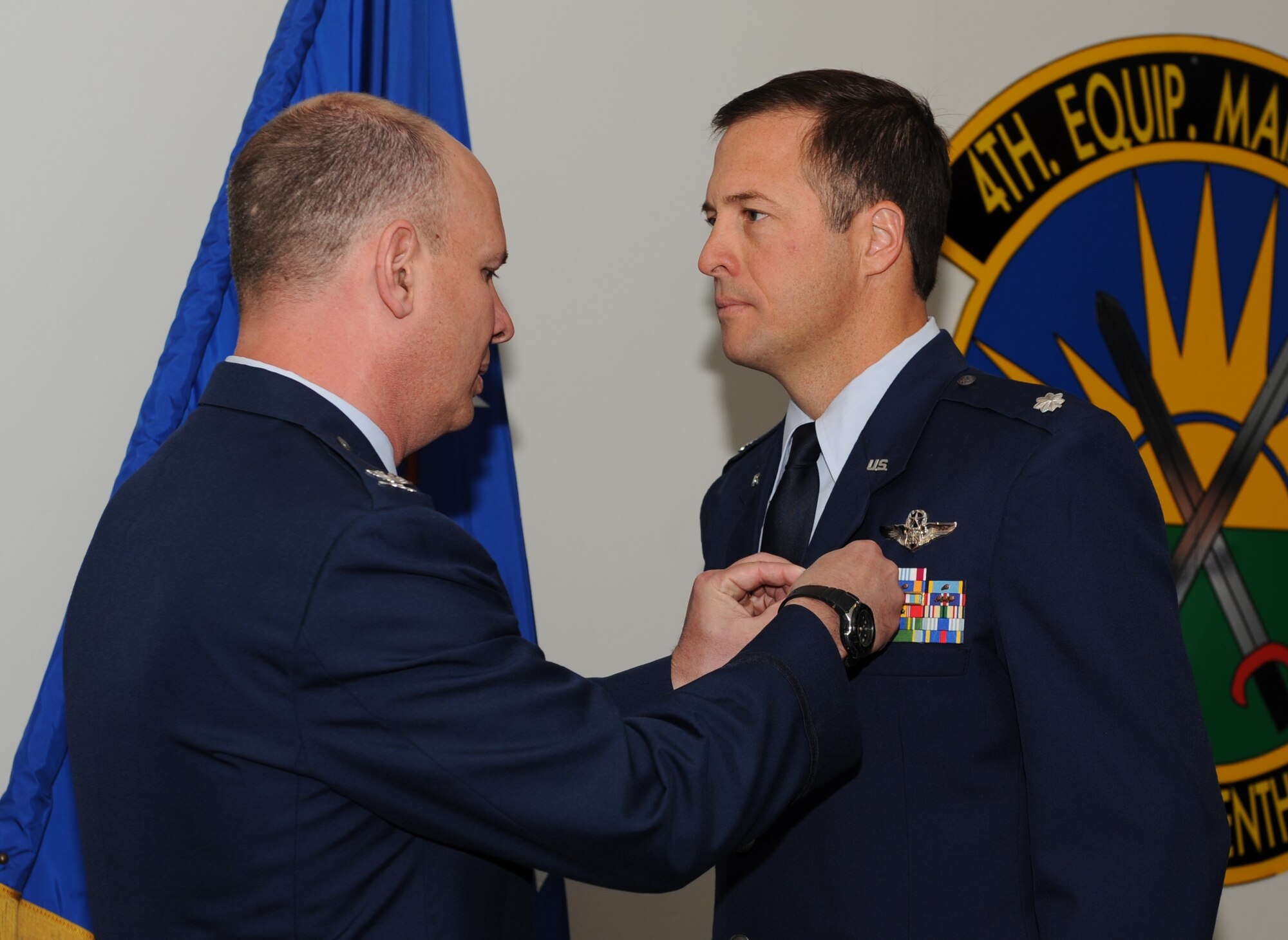 SEYMOUR JOHNSON AIR FORCE BASE, N.C. -- Col. Joseph Diana presents Lt. Col Neil Allen, with a Bronze Star Medal here April 12, 2010. A bronze star medal is the fourth highest combat award in the U.S. Armed Forces. The medal is presented only to servicemembers who perform acts of bravery, merit or meritorious service. Colonel Diana is the 4th Maintenance Group commander and Colonel Allen is the group's deputy commander. Allen is a native of Houston. (U.S. Air Force photo/Airman 1st Class Gino Reyes)