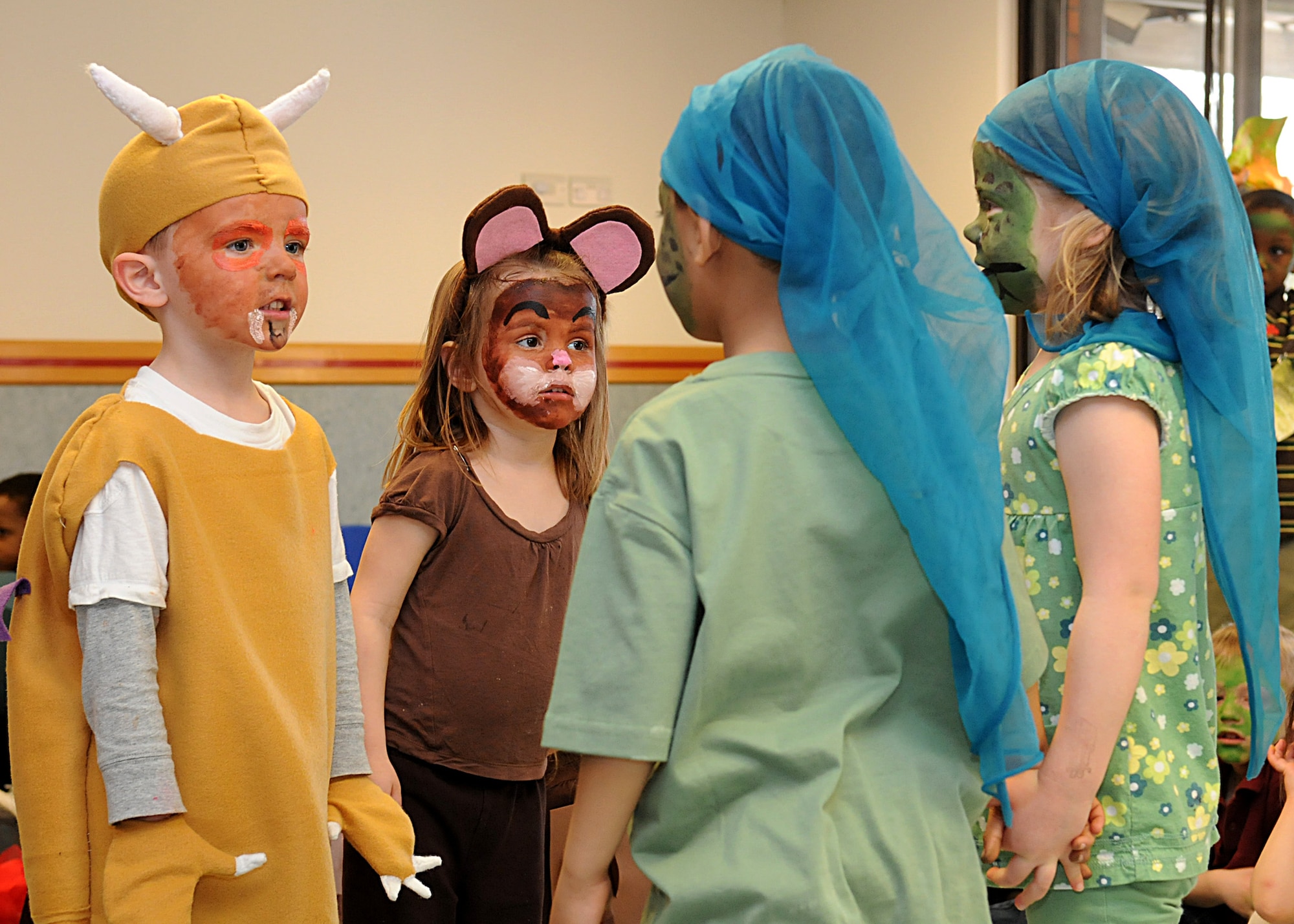RAF MILDENHALL, England – From left to right, Seth Dhayer, Shannon Webb, Kaidan Fleshman and Macy Louque act out a scene from a popular children’s book “The Gruffalo”, by Julia Donaldson, during a play performed at the Child Development Center April 8. The 4-year-olds were dressed up in costumes with matching face paint as the Gruffalo, little brown mouse and snake’s. (U.S. Air Force photo/ Staff Sgt. Jerry Fleshman)