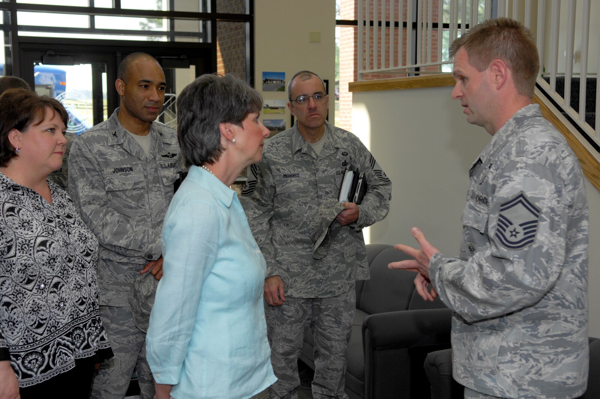 Mrs. Joanne Chavonne, co-founder of Fayettevill Cares, speaks with Senior Master Sgt. Sean Gleffe during her visit to Pope, April 6. Mrs. Chavonne has recently been selected to serve as Pope's representative on the Air Mobility Command Civic Leader's Group. (U.S. Air Force Photo by Mr. Buck Buchanan)