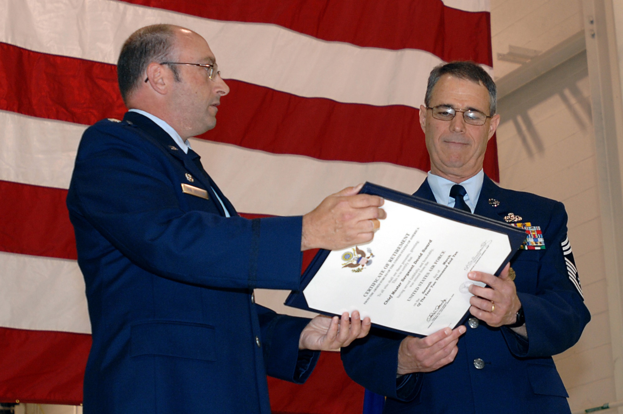 GRISSOM AIR RESERVE BASE, Ind. -- Lt. Col. Arthur L. VanHouten, III,434th Maintenance Squadron commander, presents Chief Master Sgt. David Sward with a certificate of retirement during the chief's retirement ceremony held here April 10. Chief Sward retired as the superintendent of the 434th MXS after a 37 year Air Force career. (U.S. Air Force photo/Tech. Sgt. Mark R. W. Orders-Woempner)