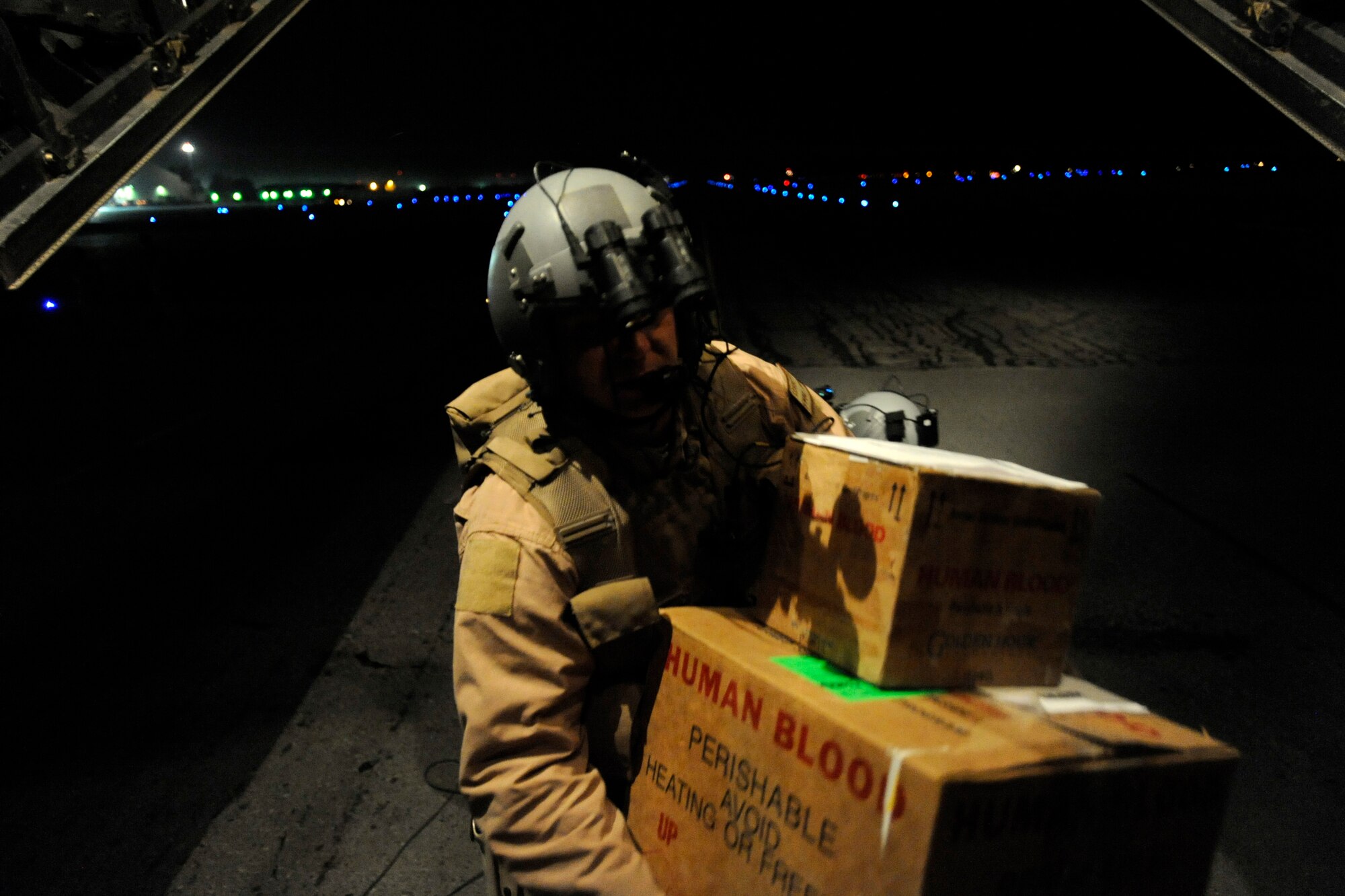 Senior Airman Michael Schoettlin, an HC-130P “Combat King” Hercules loadmaster assigned to the 79th Expeditionary Rescue Squadron, loads boxes of medical supplies prior to taking off on a combat mission, April 10, 2010, at Kandahar Airfield, Afghanistan. (U.S. Air Force photo/Staff Sgt. Manuel J. Martinez/released)
