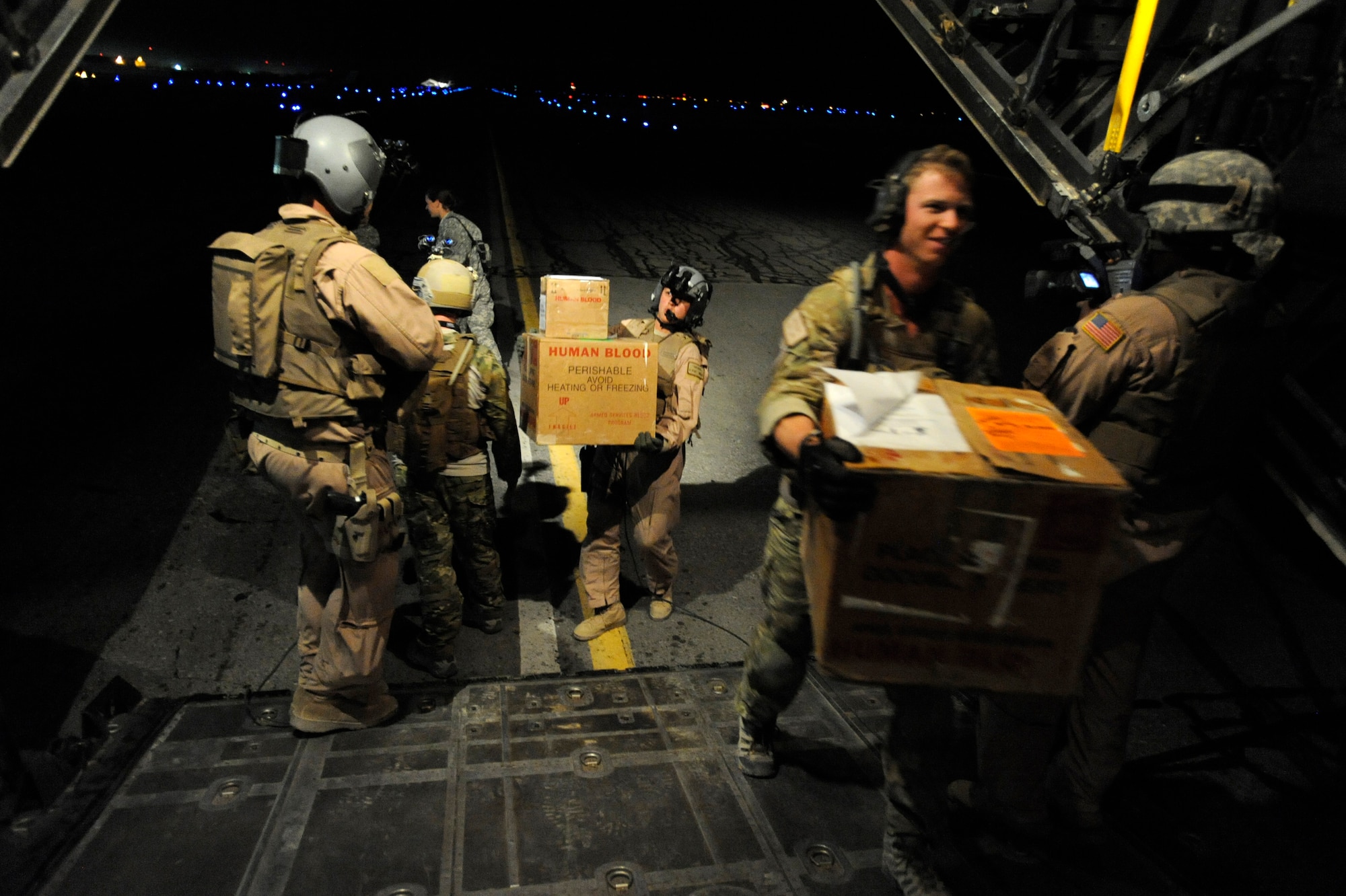 An HC-130P Hercules crew assigned to the 79th Expeditionary Rescue Squadron, load boxes of medical supplies April 10, 2010, at Kandahar Airfield, Afghanistan. (U.S. Air Force photo/Staff Sgt. Manuel J. Martinez/released)