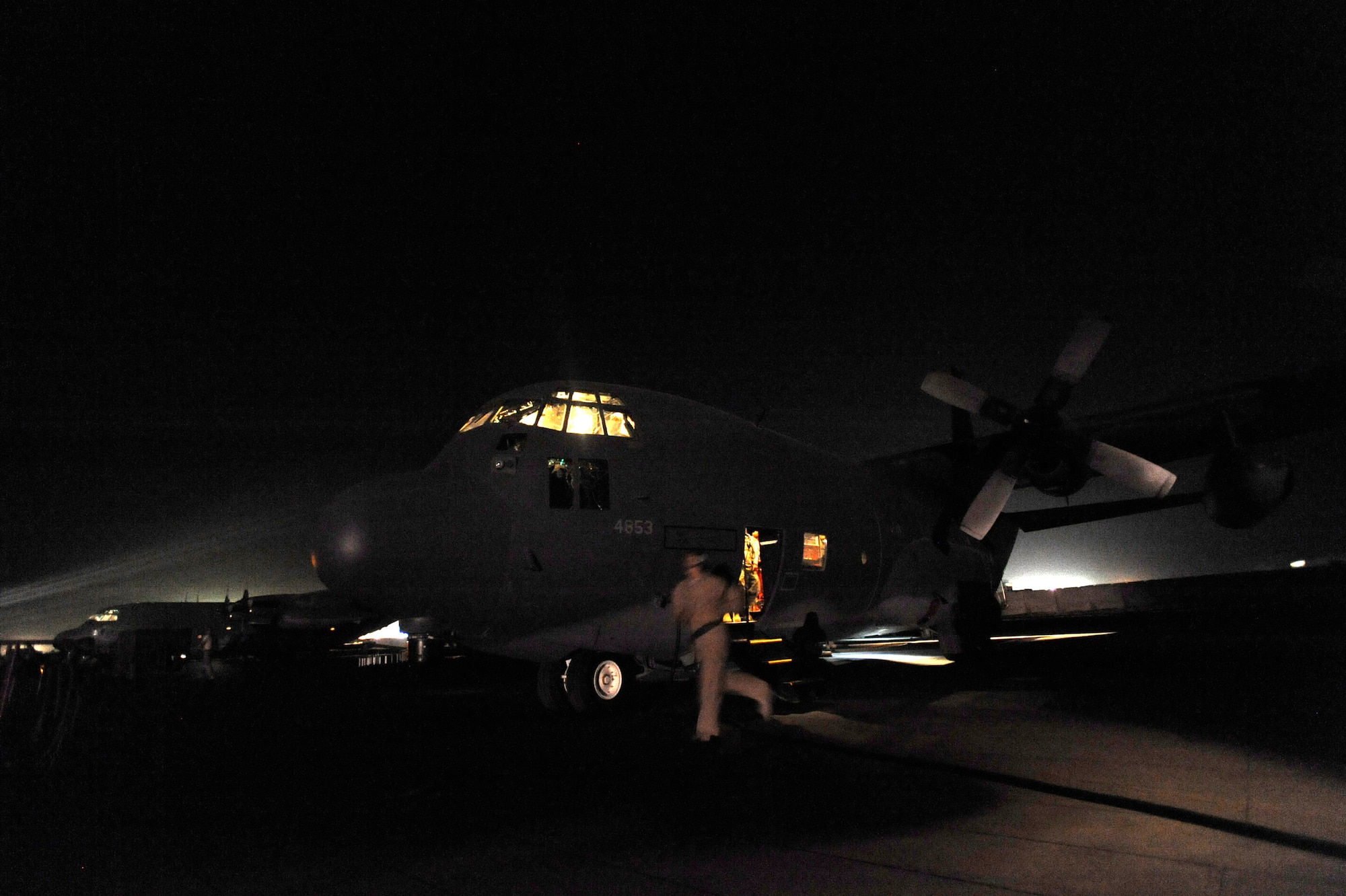 Staff Sgt. Mary Sierra an HC-130P “Combat King” Hercules loadmaster assigned to the 79th Expeditionary Rescue Squadron runs outside for pre-flight checks of an HC-130 prior to take-off on an alert mission, April 9, 2010, at Camp Bastion, Afghanistan. (U.S. Air Force photo/Staff Sgt. Manuel J. Martinez/released)