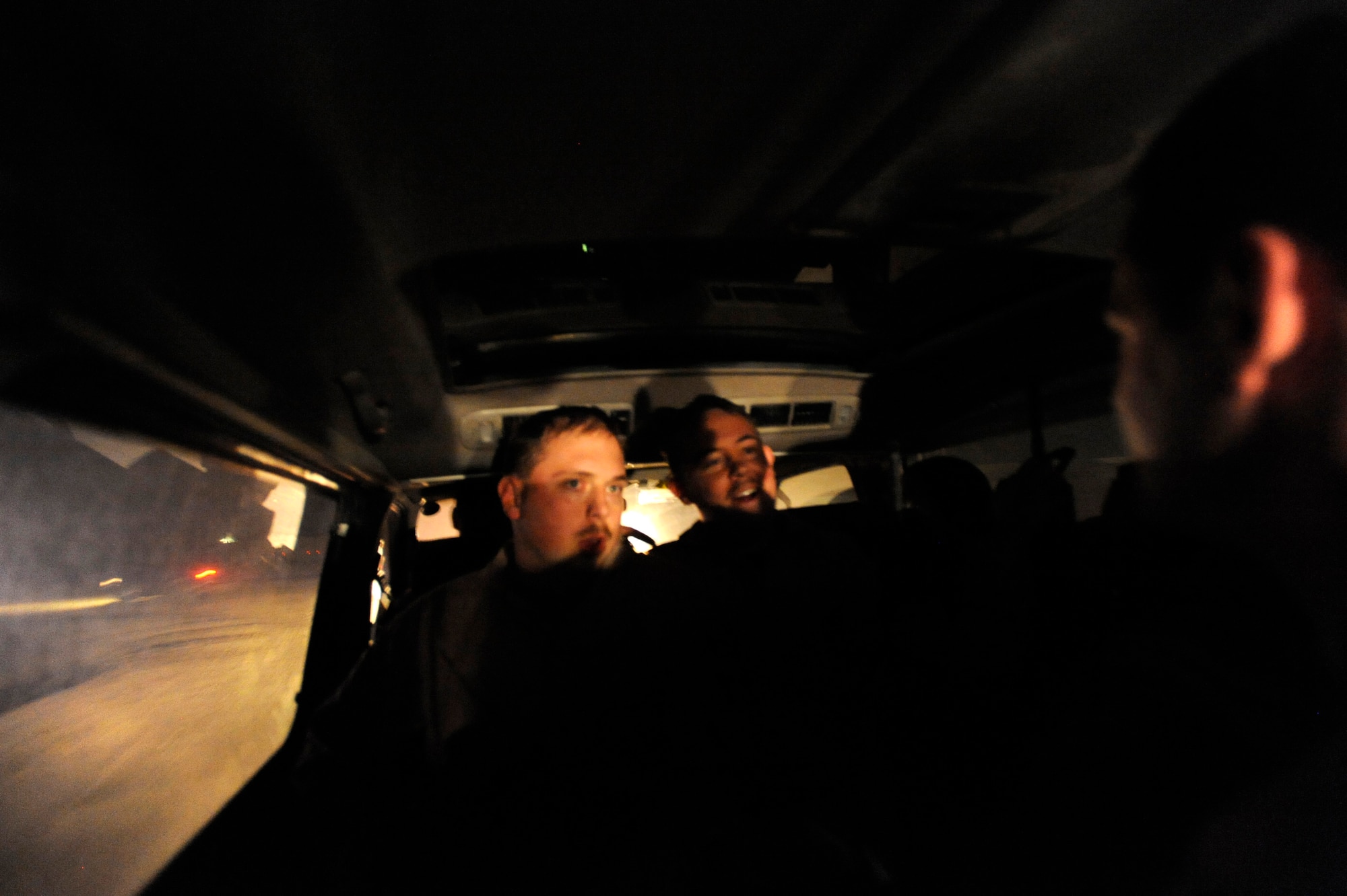 Staff Sgt. Christopher Gandy, an HC-130P “Combat King” Hercules airborne mission systems specialist, and SSgt. Joseph Wilkerson, an HC-130P flight engineer, in the 79th Expeditionary Rescue Squadron, ride a van to their HC-130 aircraft, in response to an alert, April 9, 2010, at Camp Bastion, Afghanistan. (U.S. Air Force photo/Staff Sgt. Manuel J. Martinez/released)