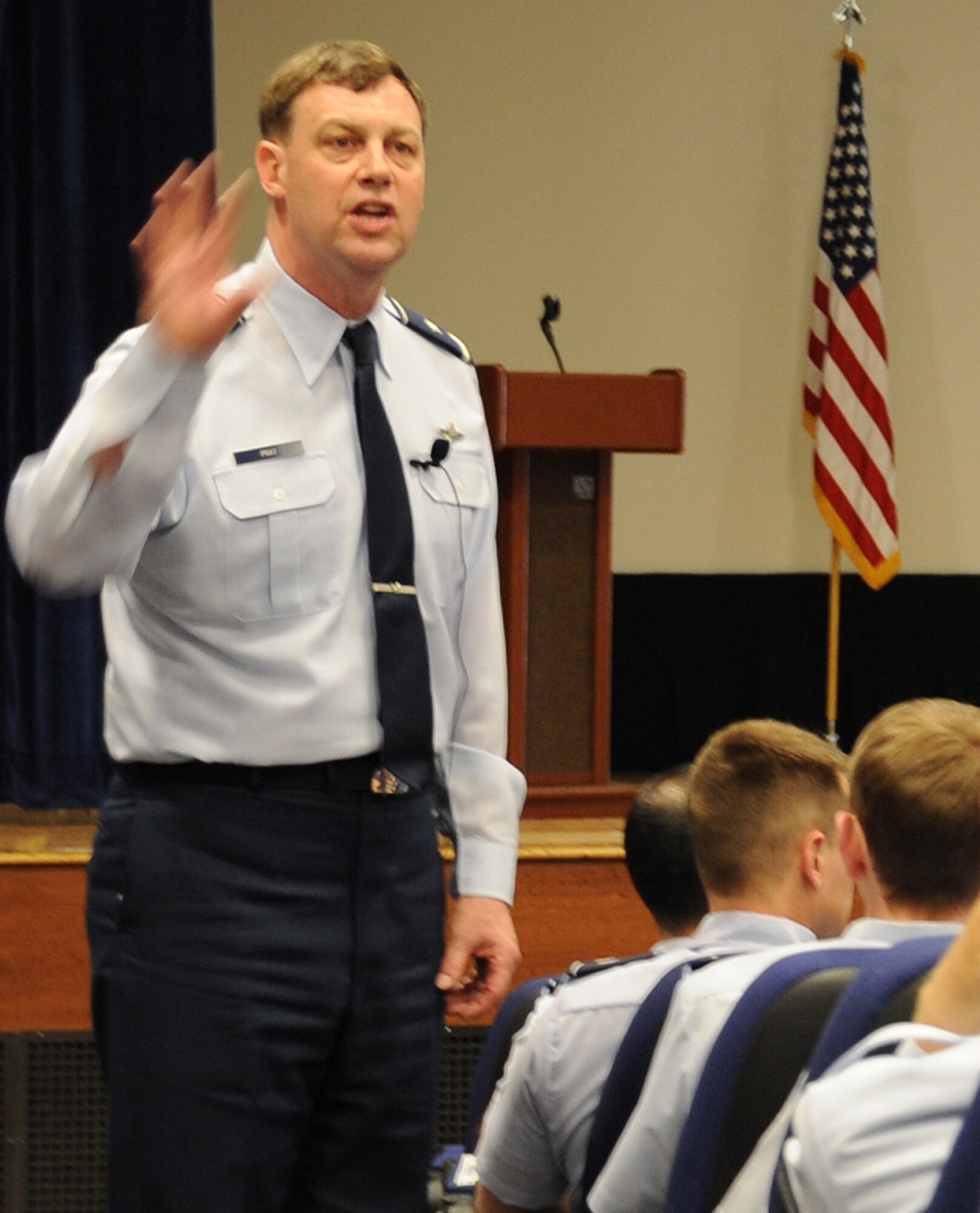 Brig. Gen. Bradley Pray, Air Mobility Command deputy director of operations, explains current force management program efforts and what impact they might have on Airmen at the McGuire theater April 5. Airmen in certain over-manned career fields have the option to take advantage of voluntary separation programs through June 30. Officials hope to meet force management goals through voluntary programs and reduced accession. (U.S. Air Force photo/Staff Sgt. Danielle Johnson)