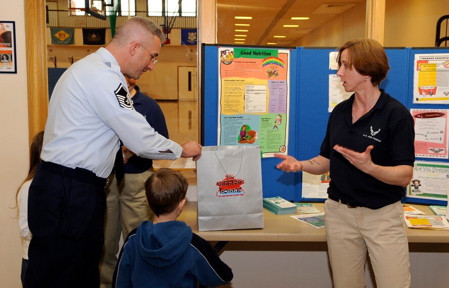RAF MILDENHALL, England – Master Sgt. Anthony Weiss, 352nd Special Operations Squadron, receives his prize for being the runner up in the Biggest Loser weight loss competition Apr. 12.  Sergeant Weiss lost 10.5 percent of his body weight adding up to 21 pounds and 4.5 inches off his waist.  (U.S. Air Force photo/Staff Sgt. Christopher L. Ingersoll)