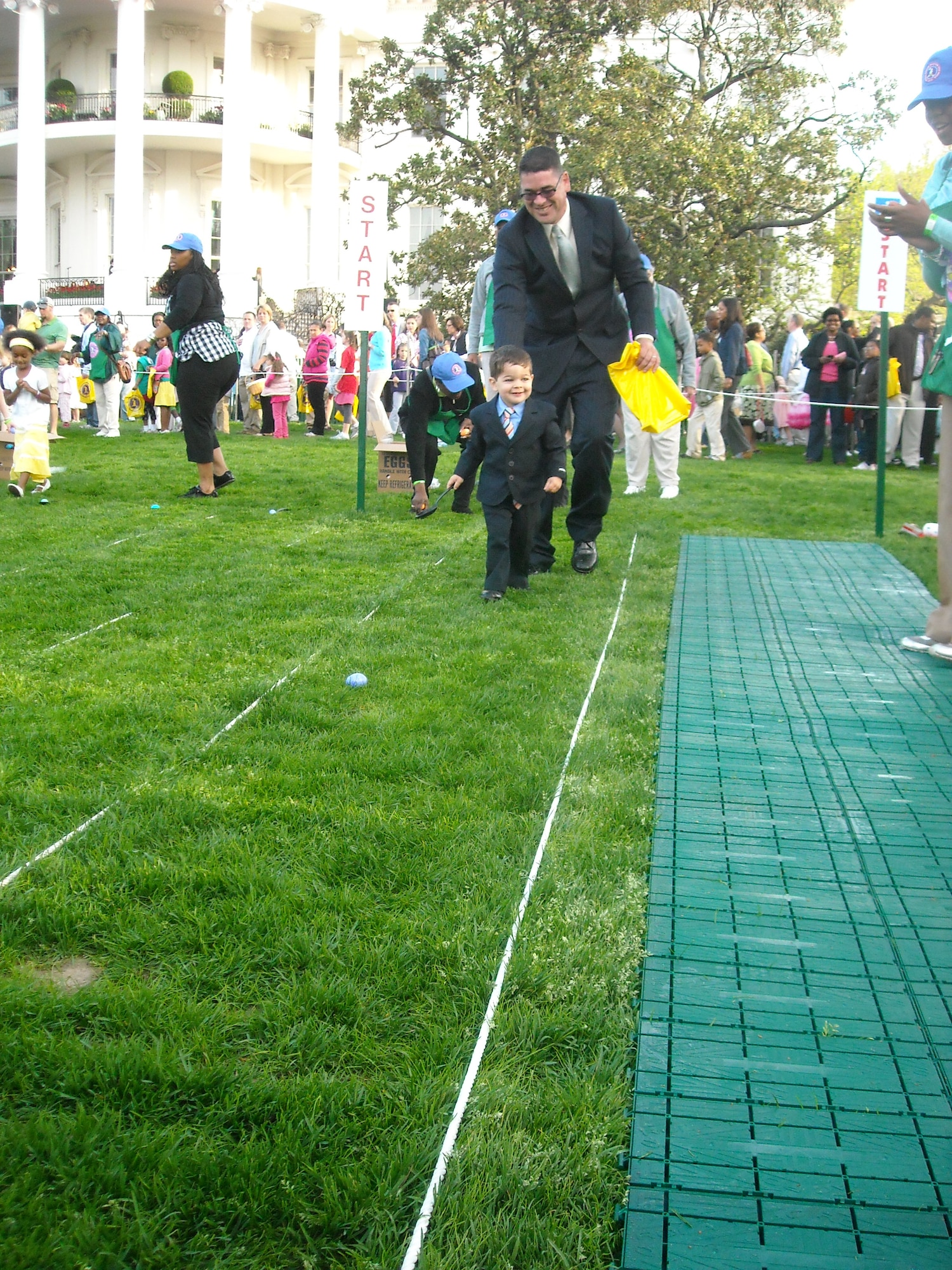 Tech. Sgt. Andrew Silkworth, 621st Contingency Response Wing, points his son Elijah in the right direction during the Easter Egg Roll at the White House April 5. Nearly 30,000 Americans joined in the annual Easter event that dates back to 1861. (Courtesy photo)