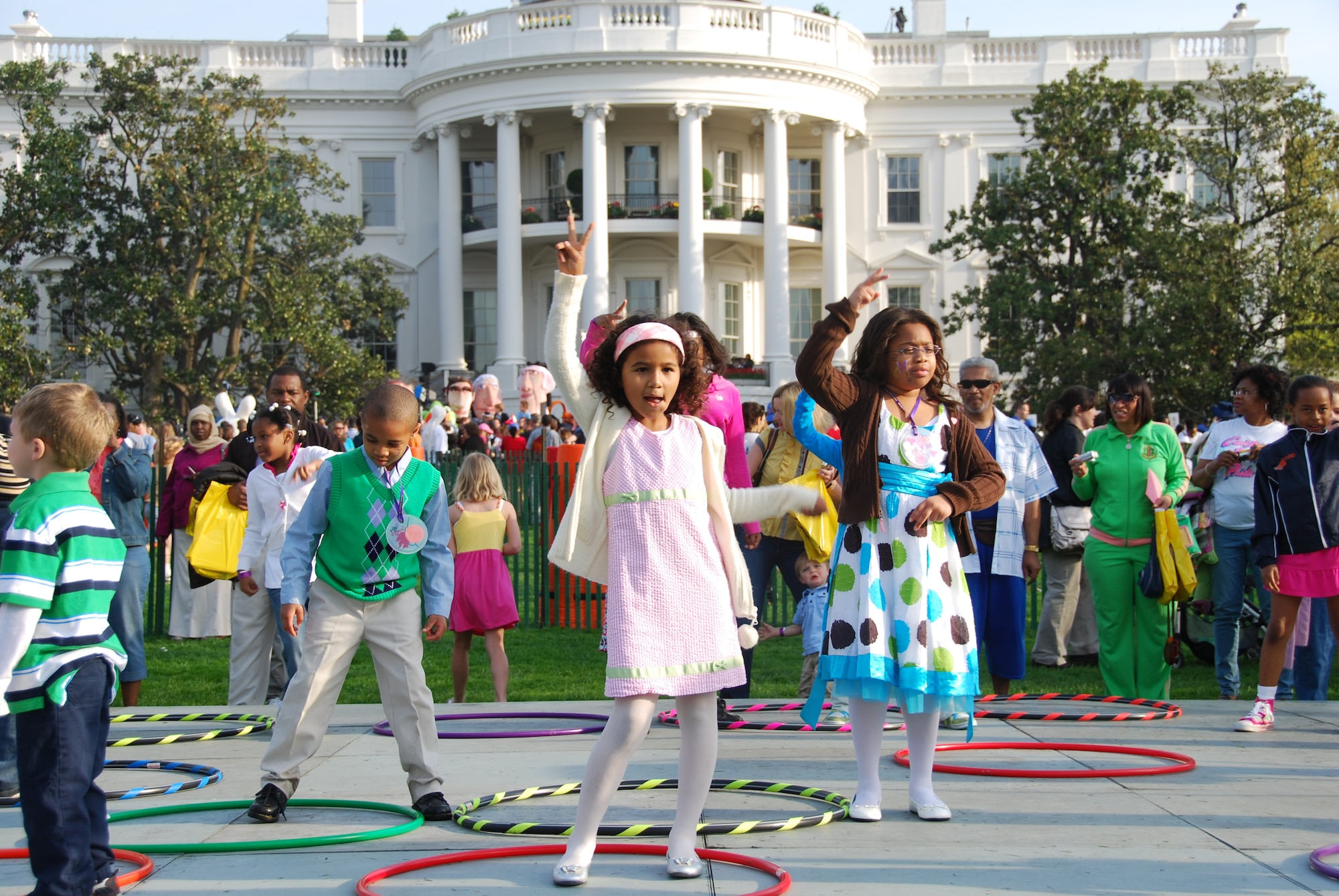 Jason and Mya Jeffries, children of Master Sgt. Donna Jeffries, 514th AMW public affairs stationed at Joint Base McGuire-Dix-Lakehurst, learn the "Peace Out" song at the "Hop To It" station during their two-hour visit at the White House for the annual Easter Egg Roll April 5. The Joint Base McGuire-Dix-Lakehurst dependents were two of 50 JB MDL members to participate in the event attended by 30,000 people. (Courtesy photo)