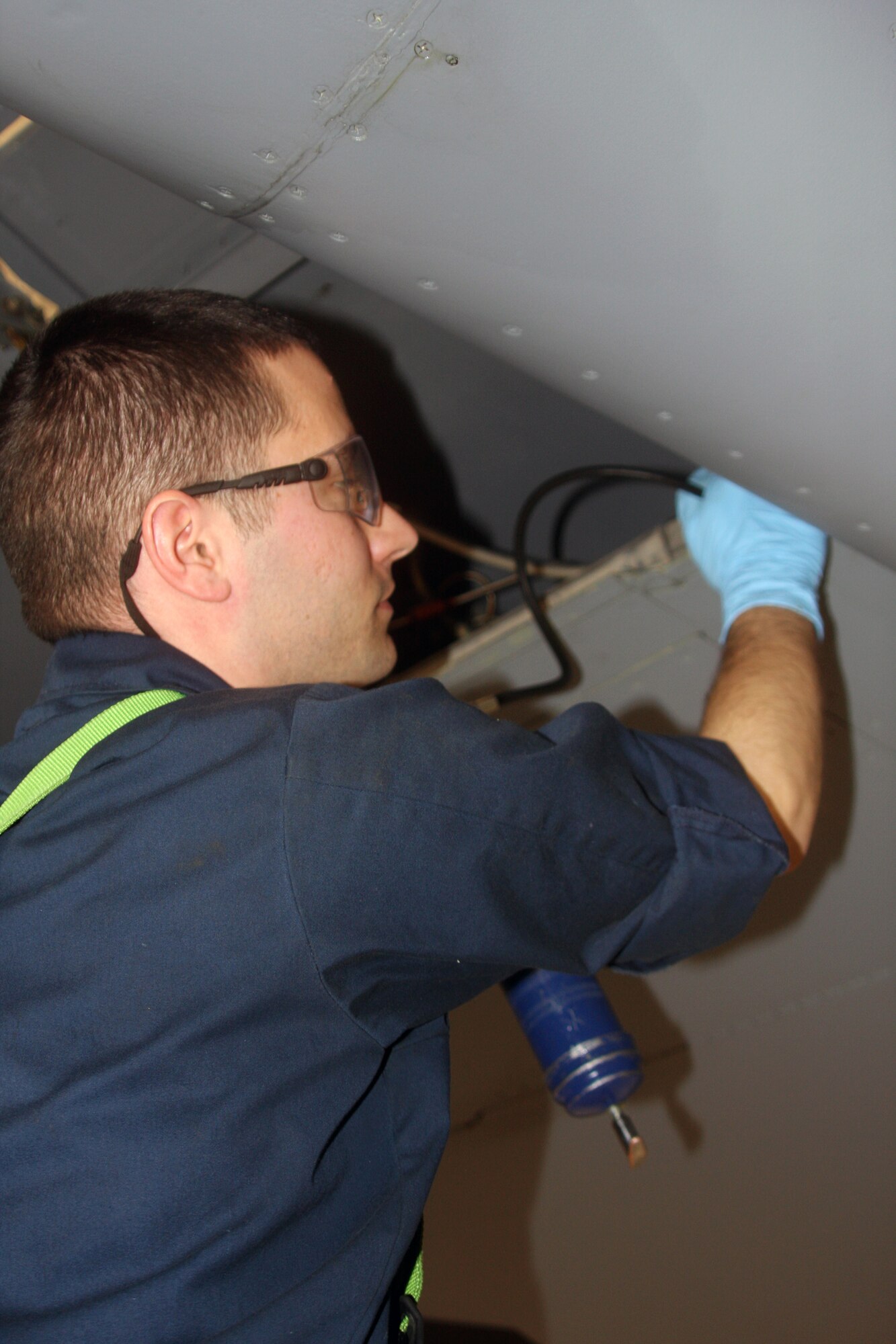 WRIGHT-PATTERSON AIR FORCE BASE, Ohio – Staff Sgt. Andrew Vierzba, 445th Maintenance Squadron, lubricates the wing flaps of a C-5 Galaxy during an isochronal Inspection March 28.  During ISO inspections, aircraft maintainers look for and repair problems in every system, from nose to tail and wingtip to wingtip.  (U.S. Air Force photo/Senior Airman Mikhail Berlin)